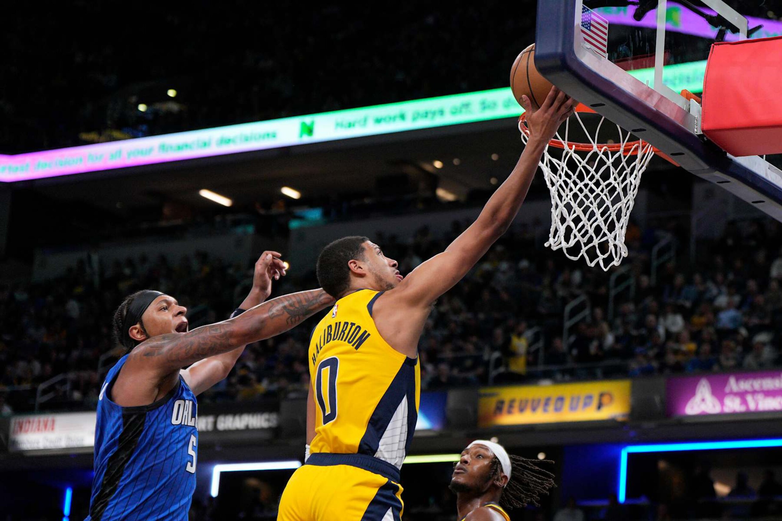 INDIANAPOLIS, INDIANA - NOVEMBER 19: Tyrese Haliburton #0 of the Indiana Pacers shoots against Paolo Banchero #5 of the Orlando Magic at Gainbridge Fieldhouse on November 19, 2023 in Indianapolis, Indiana. NOTE TO USER: User expressly acknowledges and agrees that, by downloading and or using this photograph, User is consenting to the terms and conditions of the Getty Images License Agreement. (Photo by Jeff Dean/Getty Images) INDIANAPOLIS, INDIANA - NOVEMBER 19: Tyrese Haliburton #0 of the Indiana Pacers shoots against Paolo Banchero #5 of the Orlando Magic at Gainbridge Fieldhouse on November 19, 2023 in Indianapolis, Indiana. NOTE TO USER: User expressly acknowledges and agrees that, by downloading and or using this photograph, User is consenting to the terms and conditions of the Getty Images License Agreement. (Photo by Jeff Dean/Getty Images)