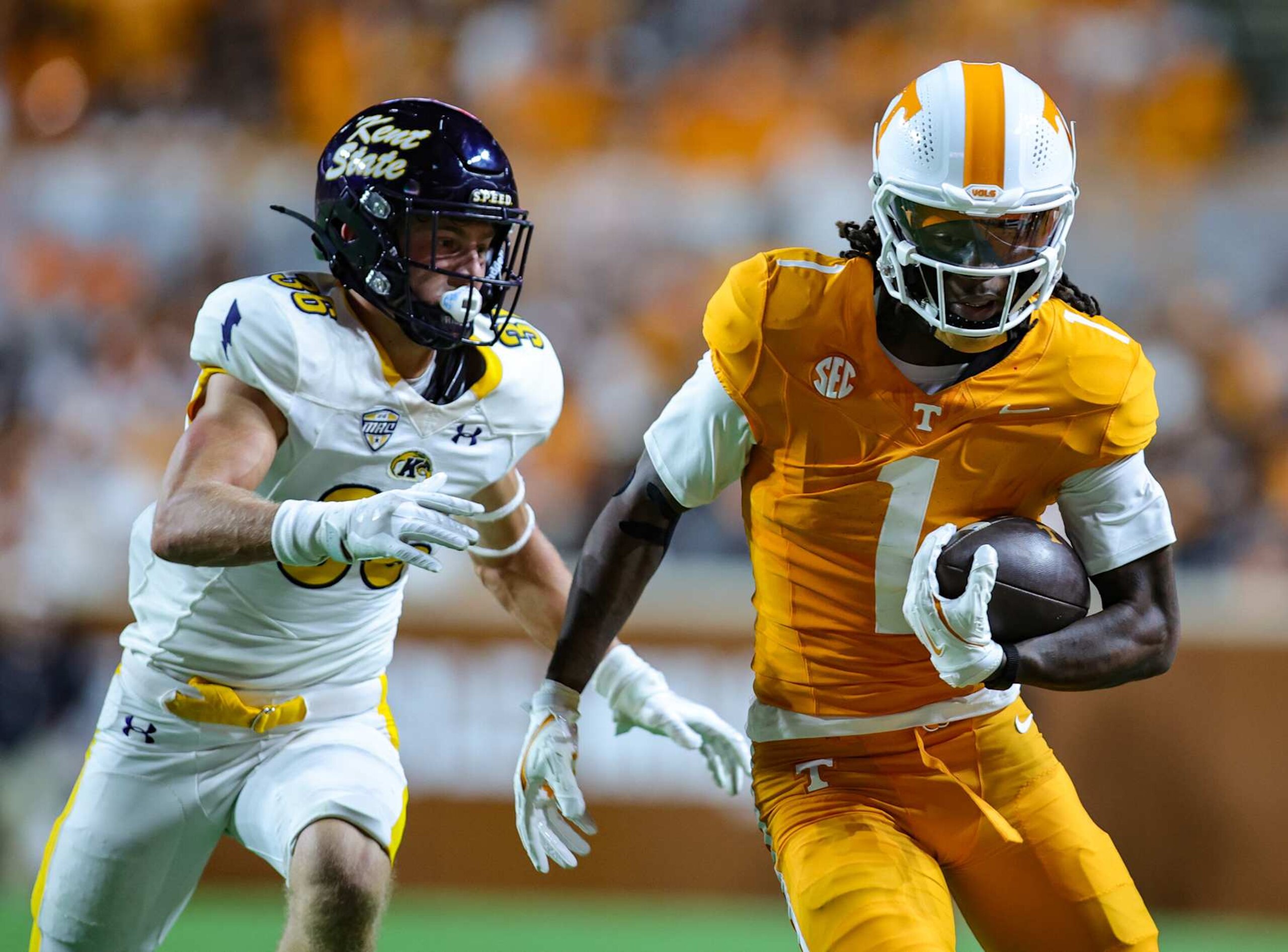 NASHVILLE, TENNESSEE - SEPTEMBER 14: Dont'e Thornton Jr. #1 of the Tennessee Volunteers runs away from Nick Cuva #36 of the Kent State Golden Flashes during the first half at Neyland Stadium on September 14, 2024 in Knoxville, Tennessee. (Photo by Brandon Sumrall/Getty Images)