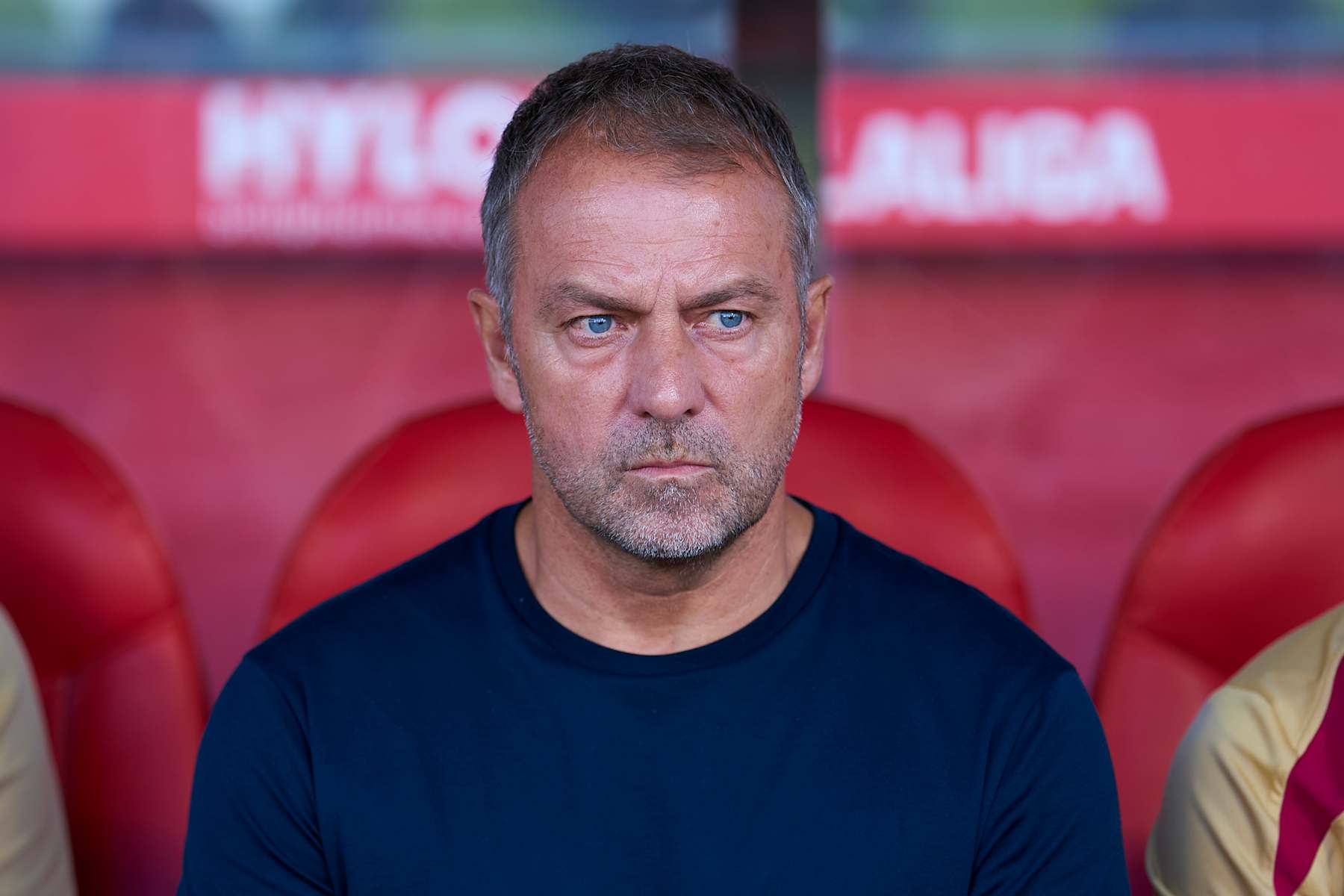 GIRONA, SPAIN - SEPTEMBER 15: Hansi Flick, head coach of FC Barcelona looks on prior to the LaLiga match between Girona FC and FC Barcelona at Estadi Municipal de Montilivi on September 15, 2024 in Girona, Spain. (Photo by Pedro Salado/Getty Images)