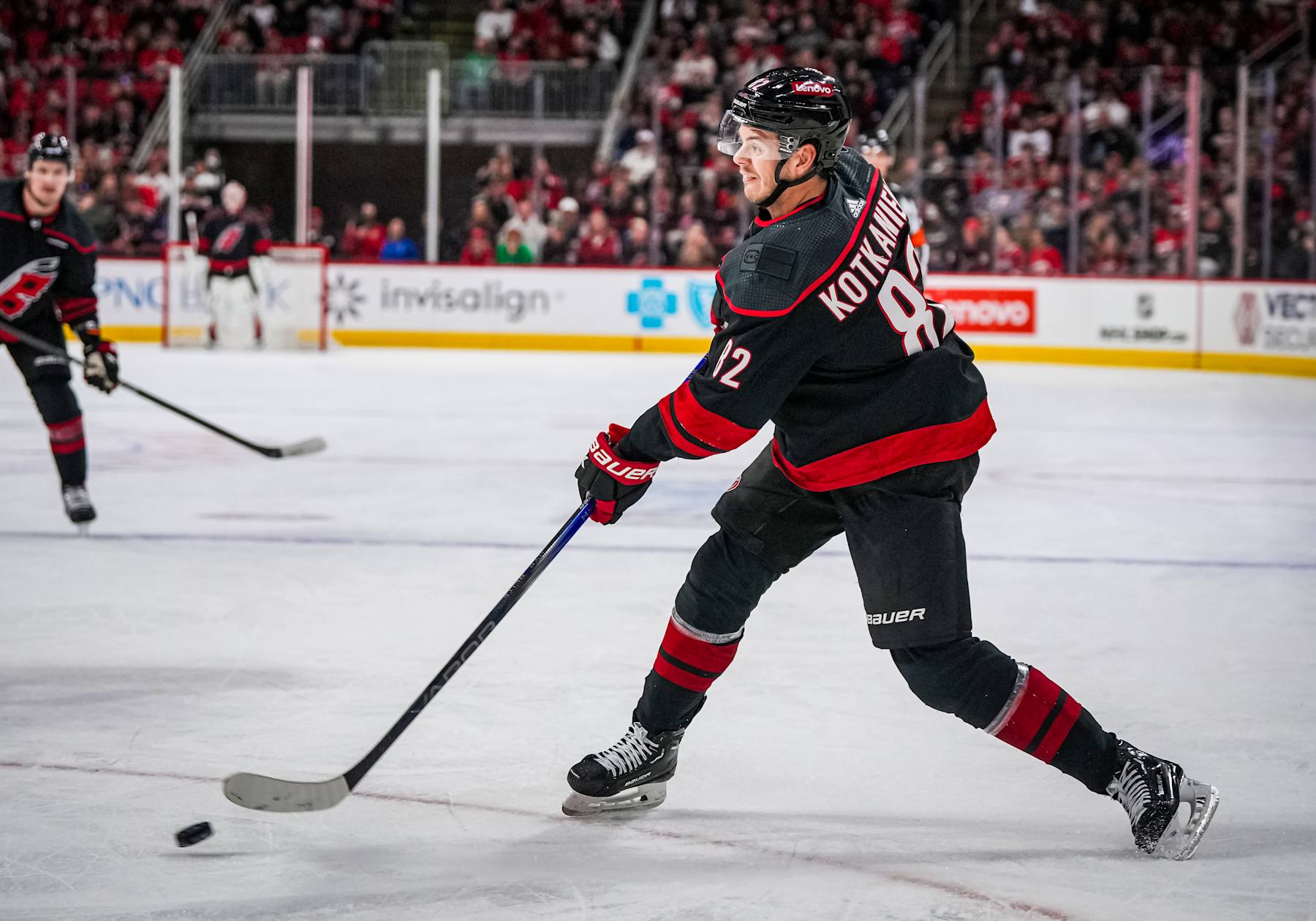 RALEIGH, NORTH CAROLINA - MARCH 10:  Jesperi Kotkaniemi #82 of the Carolina Hurricanes skates during the first period against the Calgary Flames at PNC Arena on March 10, 2024 in Raleigh, North Carolina. (Photo by Josh Lavallee/NHLI via Getty Images)