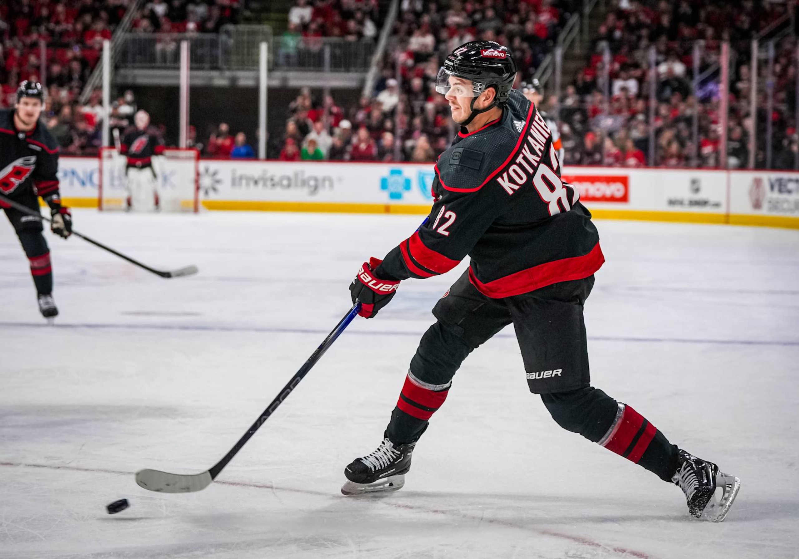 RALEIGH, NORTH CAROLINA - MARCH 10:  Jesperi Kotkaniemi #82 of the Carolina Hurricanes skates during the first period against the Calgary Flames at PNC Arena on March 10, 2024 in Raleigh, North Carolina. (Photo by Josh Lavallee/NHLI via Getty Images)