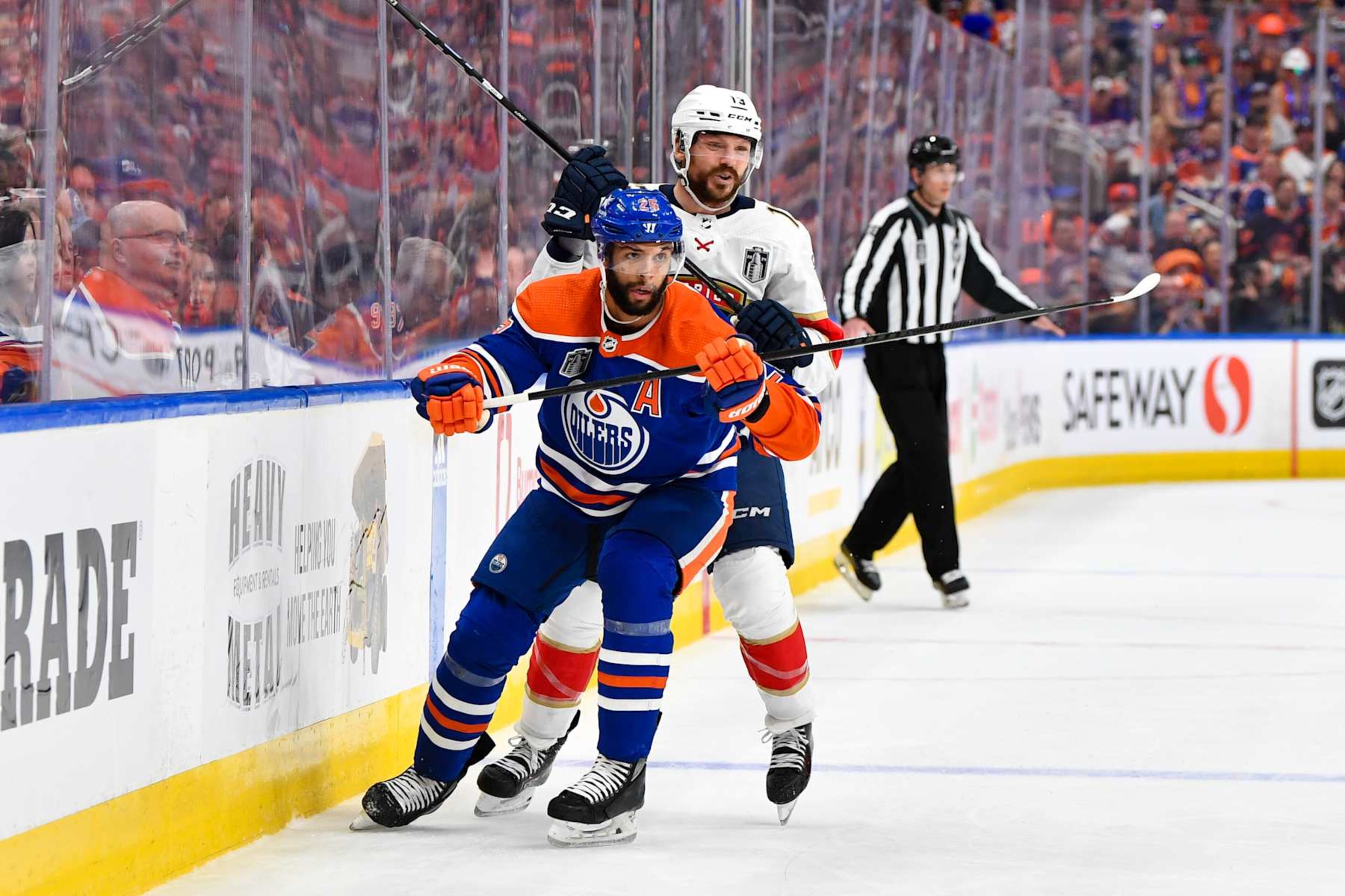 EDMONTON, CANADA - JUNE 21: Darnell Nurse #25 of the Edmonton Oilers battles for position against Sam Reinhart #13 of the Florida Panthers in Game Six of the 2024 Stanley Cup Final at Rogers Place on June 21, 2024, in Edmonton, Alberta, Canada. (Photo by Andy Devlin/NHLI via Getty Images) EDMONTON, CANADA - JUNE 21: Darnell Nurse #25 of the Edmonton Oilers battles for position against Sam Reinhart #13 of the Florida Panthers in Game Six of the 2024 Stanley Cup Final at Rogers Place on June 21, 2024, in Edmonton, Alberta, Canada. (Photo by Andy Devlin/NHLI via Getty Images)