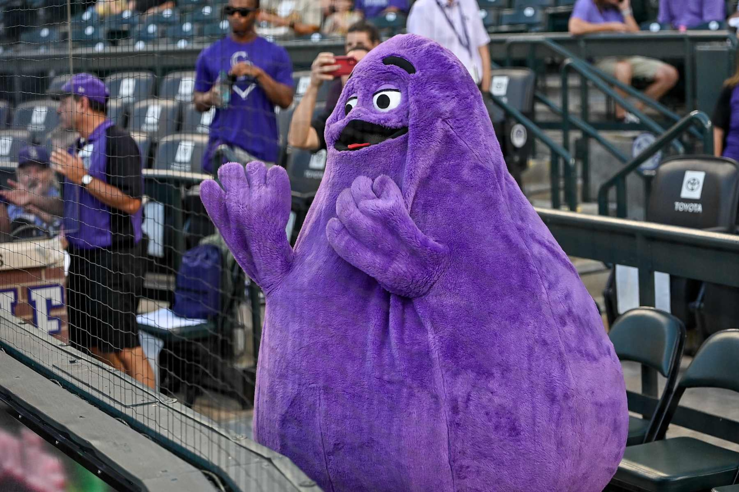 DENVER, COLORADO - AUGUST 16: A performer looks on in the costume of McDonaldland mascot Grimace before a game between the Colorado Rockies and the San Diego Padres at Coors Field on August 16, 2024 in Denver, Colorado. (Photo by Dustin Bradford/Getty Images)