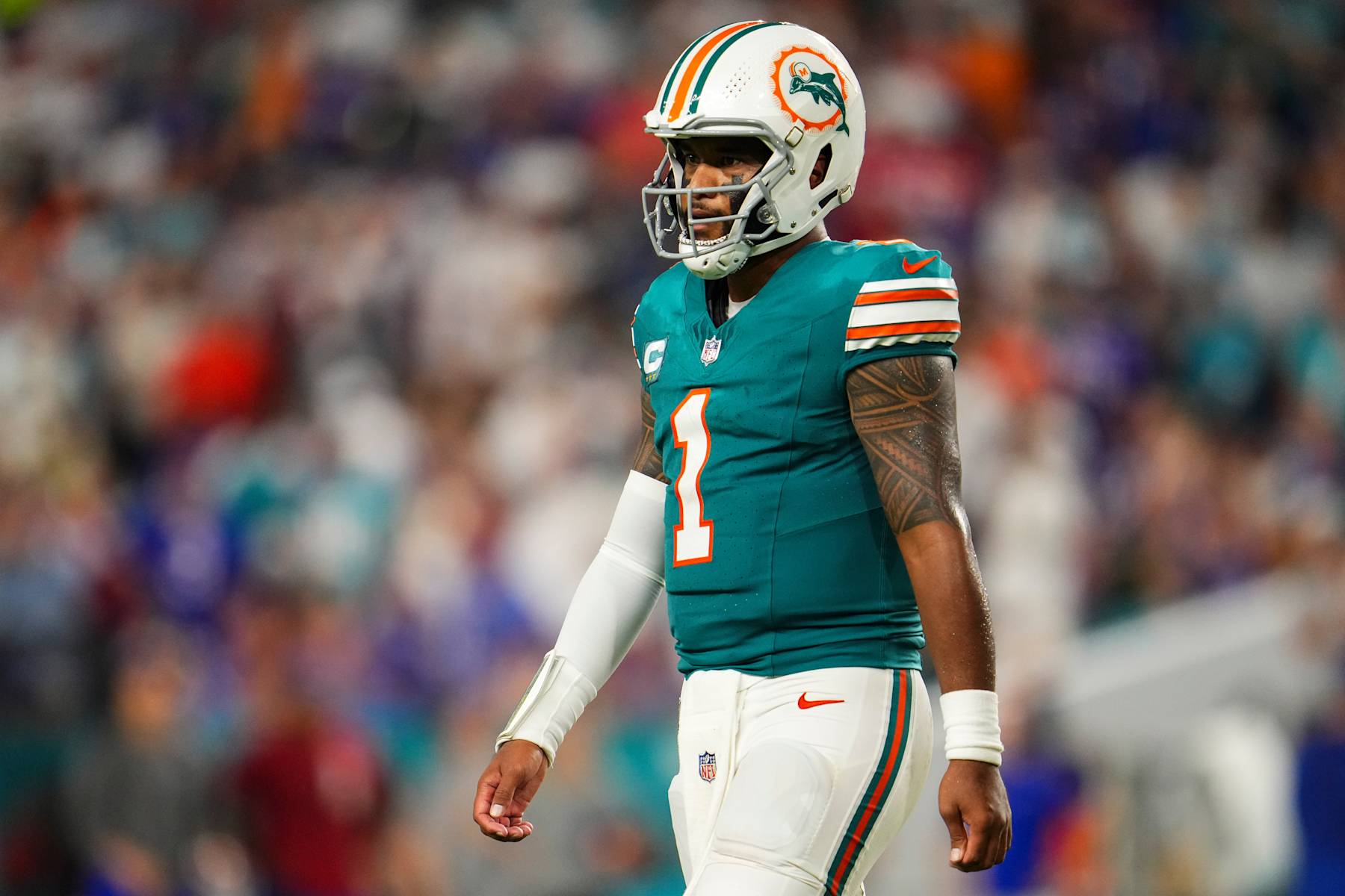 MIAMI GARDENS, FL - SEPTEMBER 12: Tua Tagovailoa #1 of the Miami Dolphins looks on from the field during an NFL football game against the Buffalo Bills at Hard Rock Stadium on September 12, 2024 in Miami Gardens, Florida. (Photo by Cooper Neill/Getty Images)