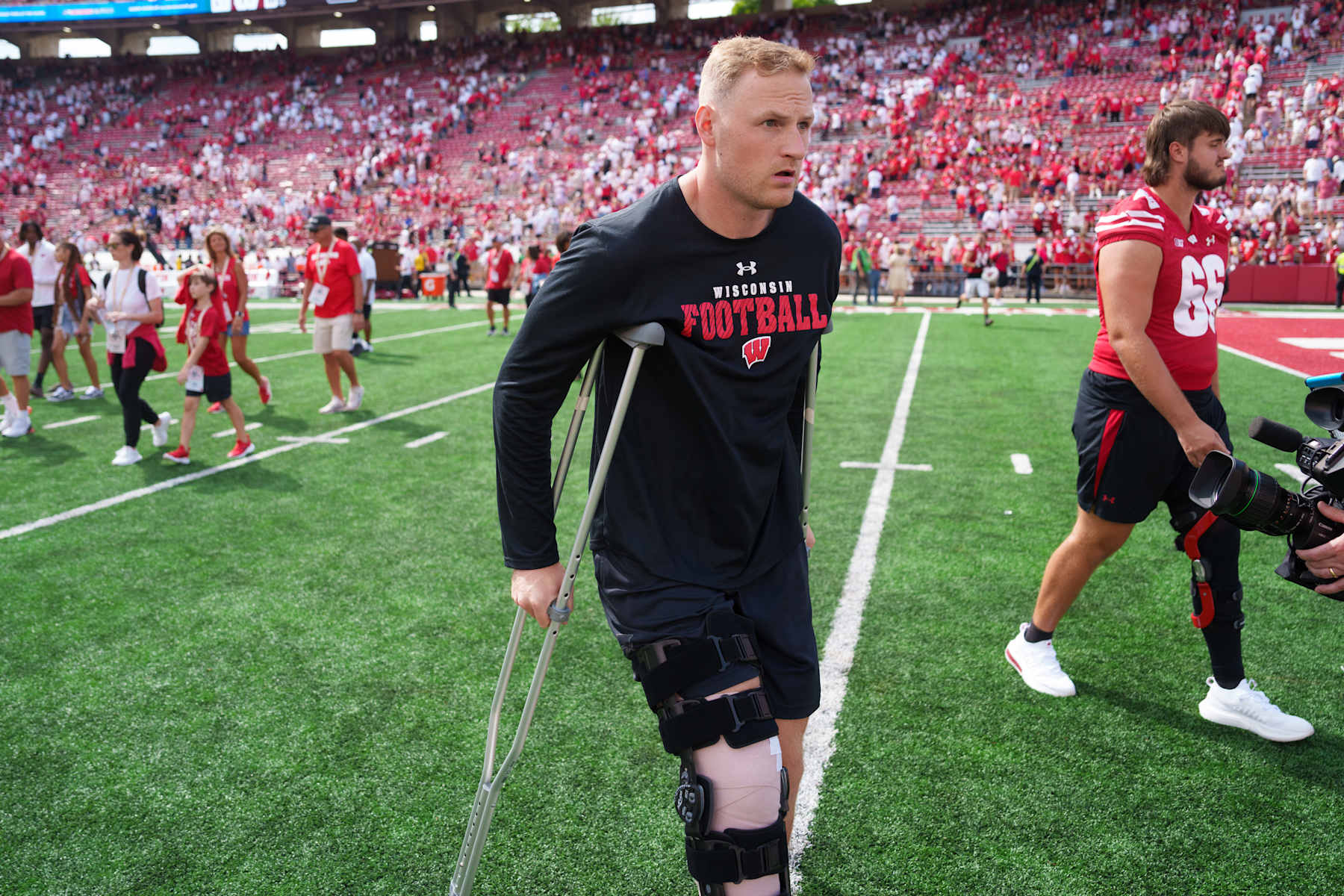 MADISON, WISCONSIN - SEPTEMBER 14: Quarterback Tyler Van Dyke  #10 of the Wisconsin Badgers walks off the field using crutches following an NCAA college football game against the Alabama Crimson Tide at Camp Randall Stadium on September 14, 2024 in Madison, Wisconsin. (Photo by Todd Rosenberg/Getty Images)