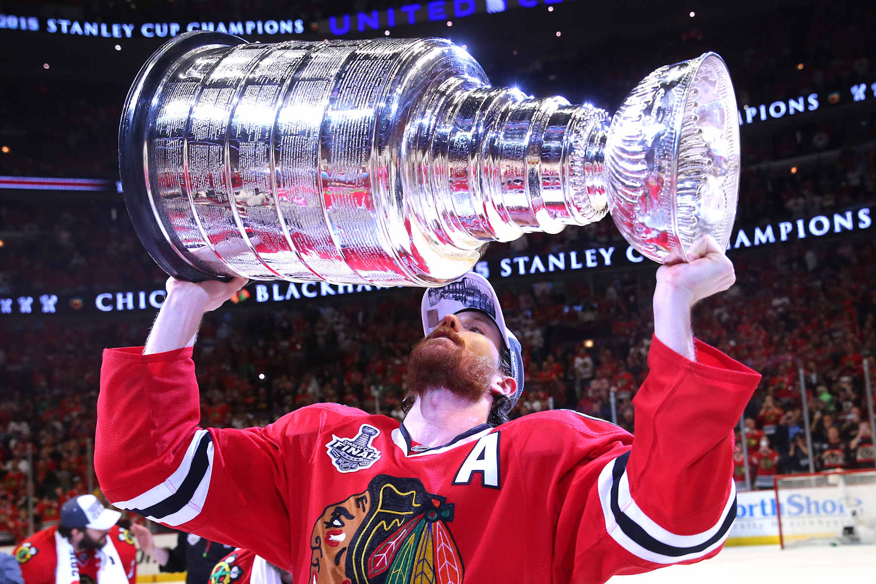 CHICAGO, IL - JUNE 15: Duncan Keith #2 of the Chicago Blackhawks celebrates by hoisting the Stanley Cup after defeating the Tampa Bay Lightning by a score of 2-0 in Game Six to win the 2015 NHL Stanley Cup Final at the United Center on June 15, 2015 in Chicago, Illinois. (Photo by Bruce Bennett/Getty Images)