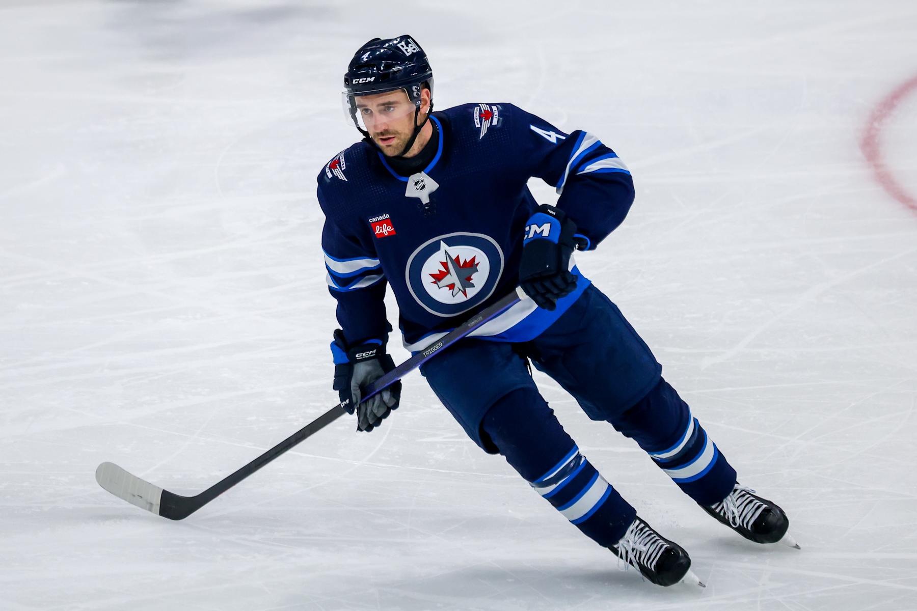 WINNIPEG, CANADA - APRIL 23: Neal Pionk #4 of the Winnipeg Jets skates during third period action against the Colorado Avalanche in Game Two of the First Round of the 2024 Stanley Cup Playoffs at Canada Life Centre on April 23, 2024 in Winnipeg, Manitoba, Canada. (Photo by Jonathan Kozub/NHLI via Getty Images)