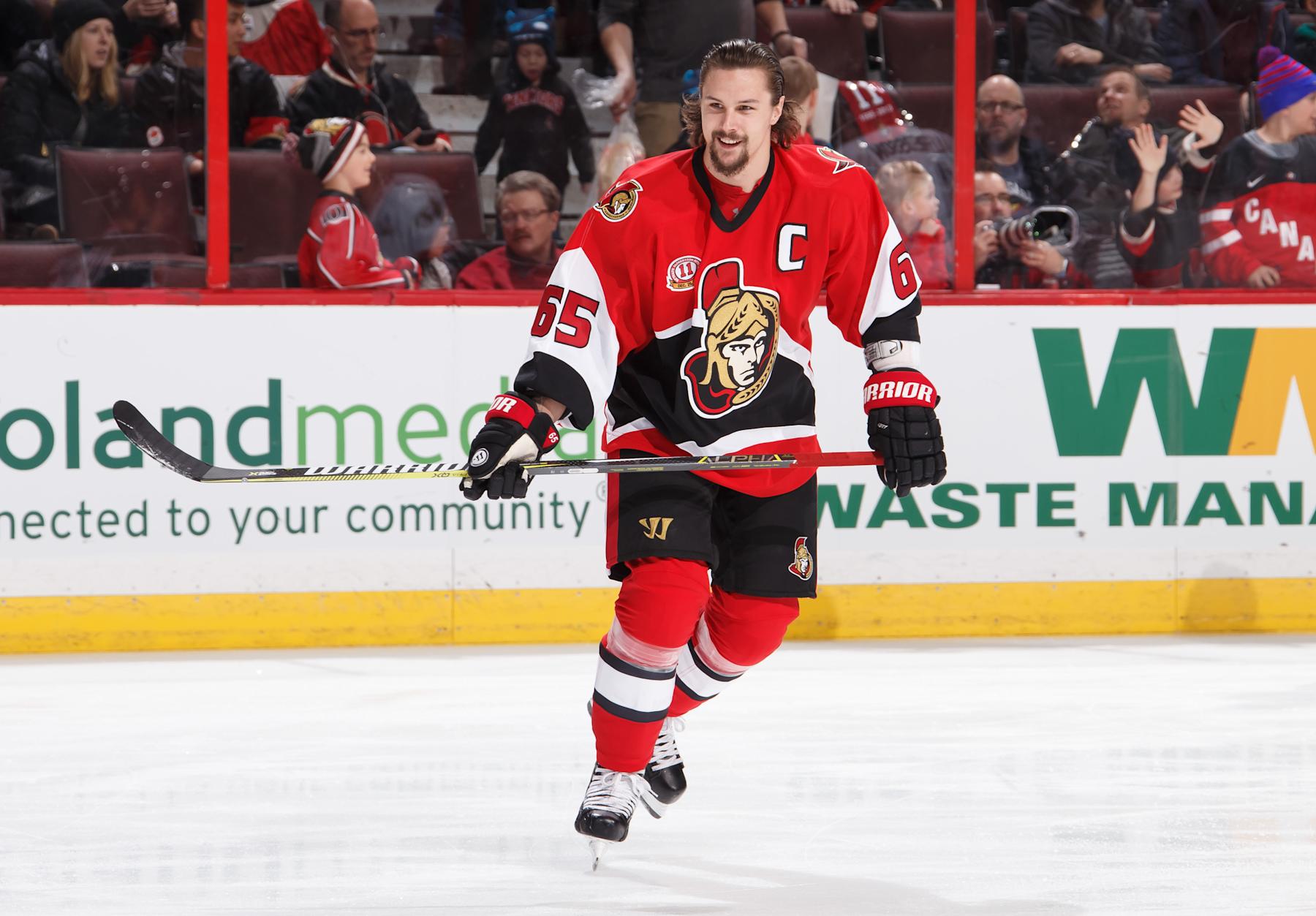 OTTAWA, ON - DECEMBER 29: Erik Karlsson #65 of the Ottawa Senators smiles as he wears a throwback jersey in honor of Daniel Alfredsson on his jersey retirement night prior to a game against the Detroit Red Wings at Canadian Tire Centre on December 29, 2016 in Ottawa, Ontario, Canada. (Photo by Andre Ringuette/NHLI via Getty Images)