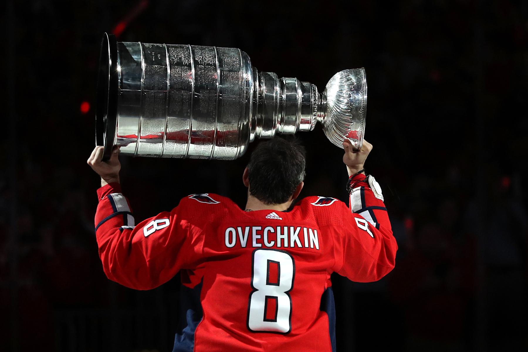 WASHINGTON, DC - OCTOBER 03: Alex Ovechkin #8 of the Washington Capitals skates with the Stanley Cup prior to watching the 2018 Stanley Cup Championship banner rise to the rafters before playing against the Boston Bruins at Capital One Arena on October 3, 2018 in Washington, DC. (Photo by Patrick Smith/Getty Images)