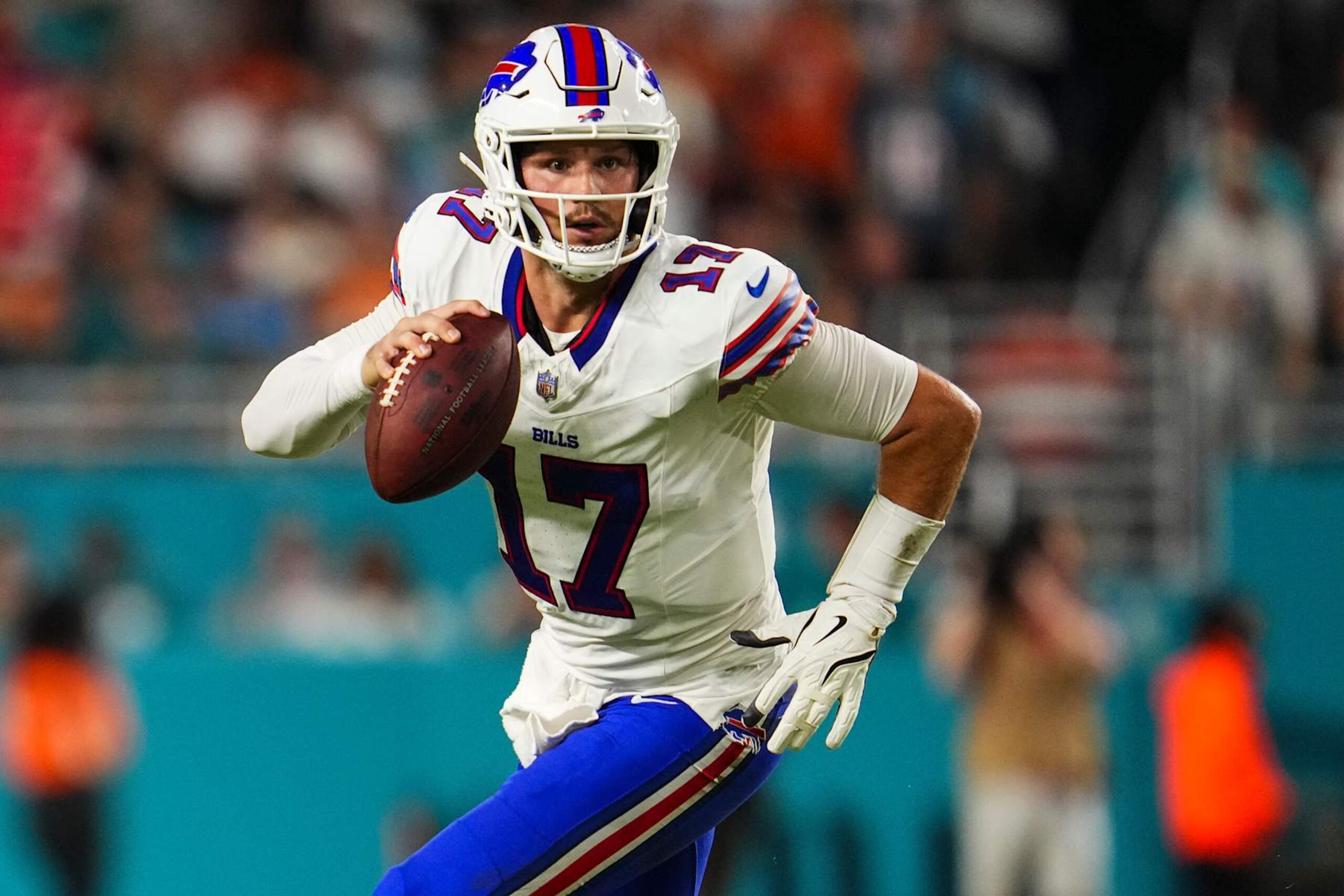 MIAMI GARDENS, FL - SEPTEMBER 12: Josh Allen #17 of the Buffalo Bills scrambles out of the pocket during an NFL football game against the Miami Dolphins at Hard Rock Stadium on September 12, 2024 in Miami Gardens, Florida. (Photo by Cooper Neill/Getty Images)