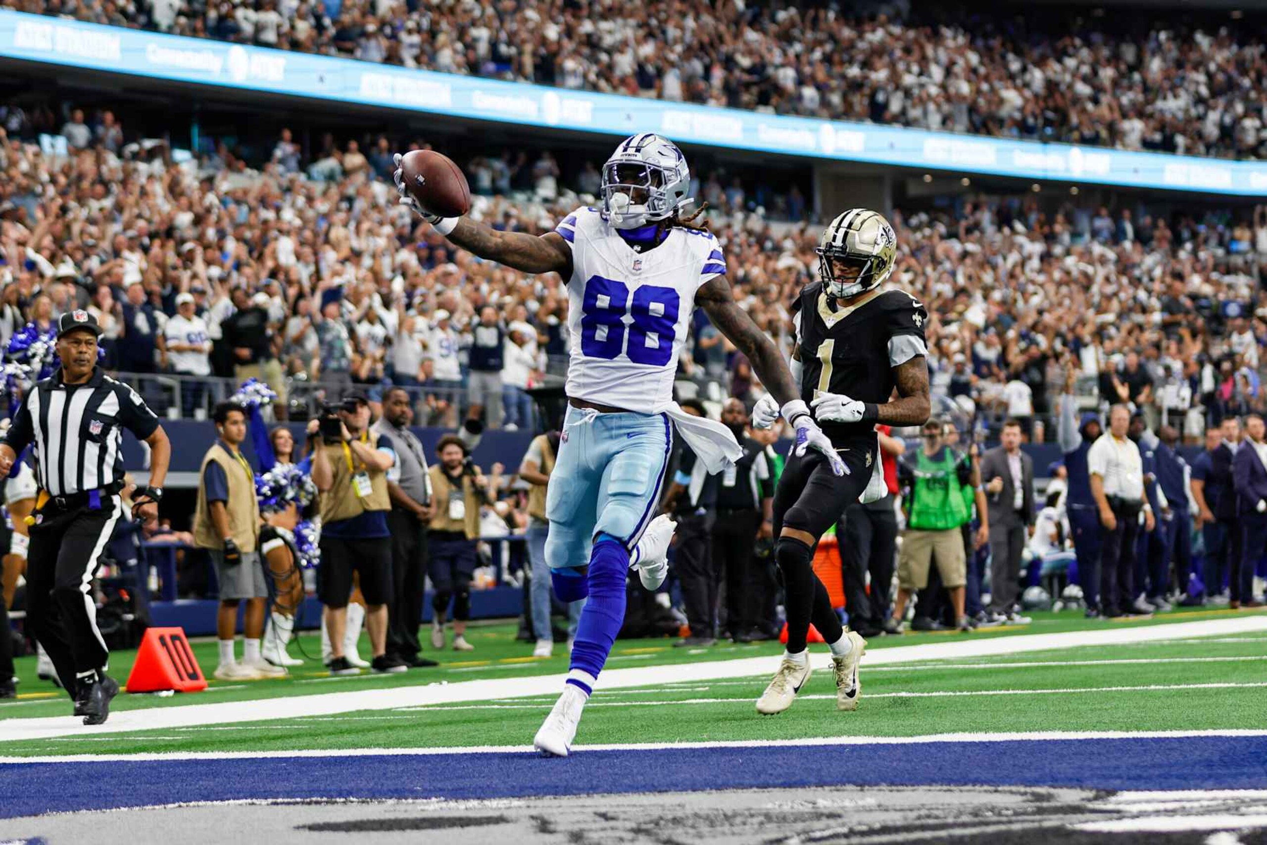 ARLINGTON, TX - SEPTEMBER 15: Dallas Cowboys wide receiver CeeDee Lamb (88) scores a touchdown during the game between the Dallas Cowboys and the New Orleans Saints on September 15, 2024 at AT&T Stadium in Arlington, Texas. (Photo by Matthew Pearce/Icon Sportswire via Getty Images)