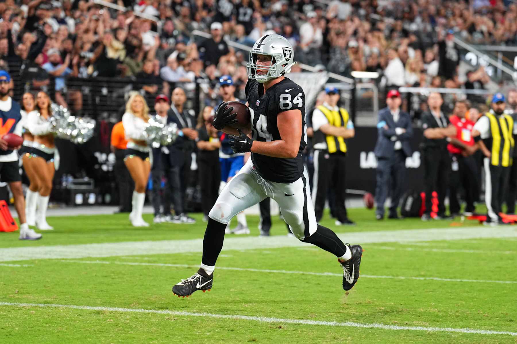 LAS VEGAS, NEVADA - AUGUST 17: Tight end Harrison Bryant #84 of the Las Vegas Raiders catches a 5-yard touchdown pass during the second half of a preseason game against the Dallas Cowboys at Allegiant Stadium on August 17, 2024 in Las Vegas, Nevada. (Photo by Chris Unger/Getty Images)