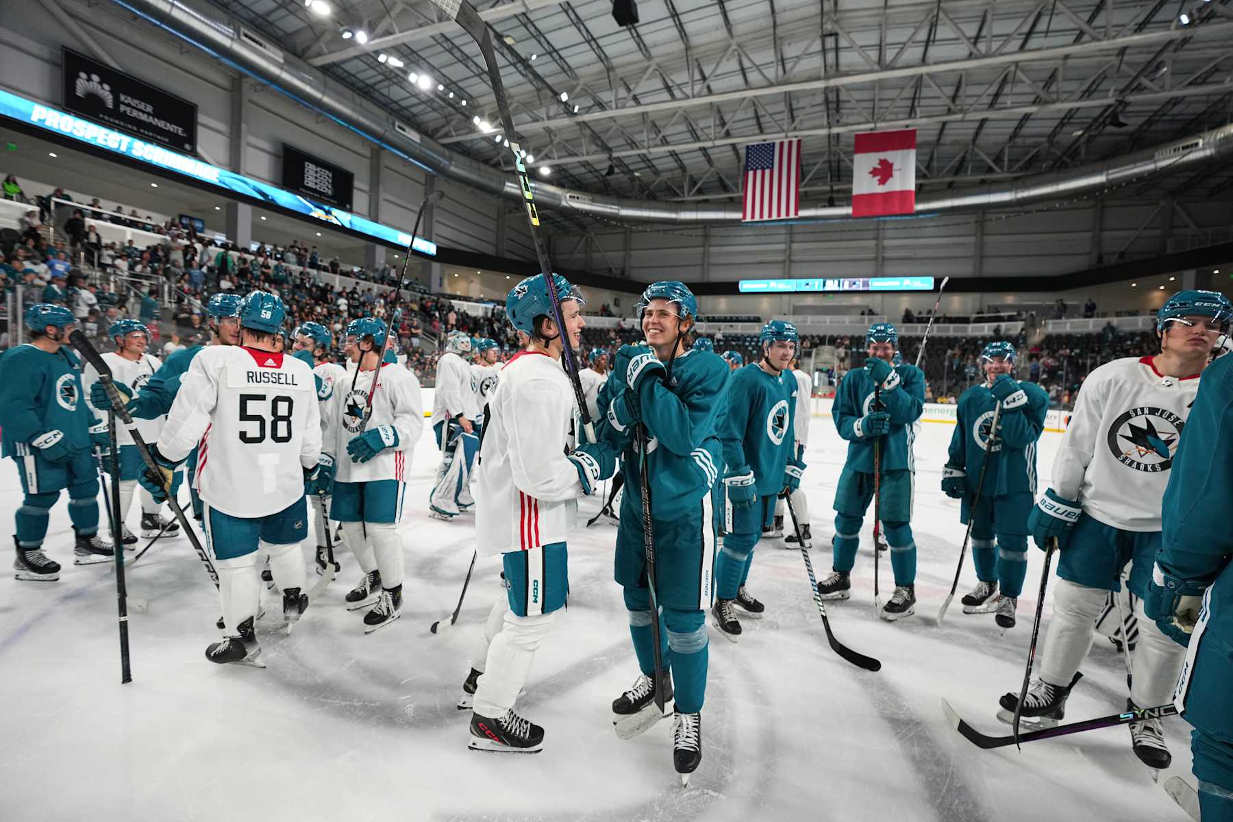 Will Smith #2 and Macklin Celebrini #71 of the San Jose Sharks talk on the ice after the San Jose Sharks Prospect Scrimmage at Tech CU Arena on July 4, 2024 in San Jose, California