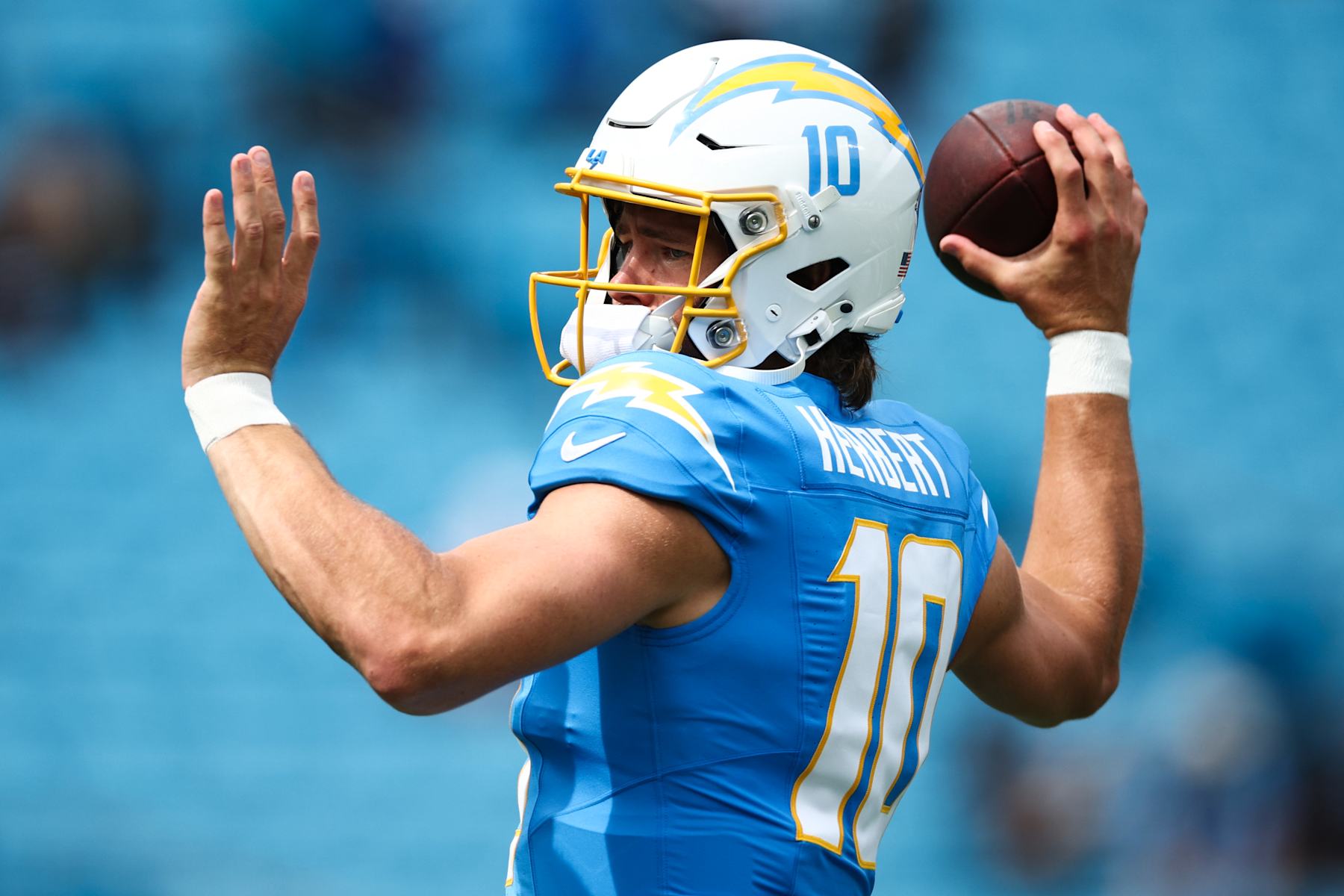 CHARLOTTE, NORTH CAROLINA - SEPTEMBER 15: Justin Herbert #10 of the Los Angeles Chargers warms up prior to a game against the Carolina Panthers at Bank of America Stadium on September 15, 2024 in Charlotte, North Carolina. (Photo by Jared C. Tilton/Getty Images)