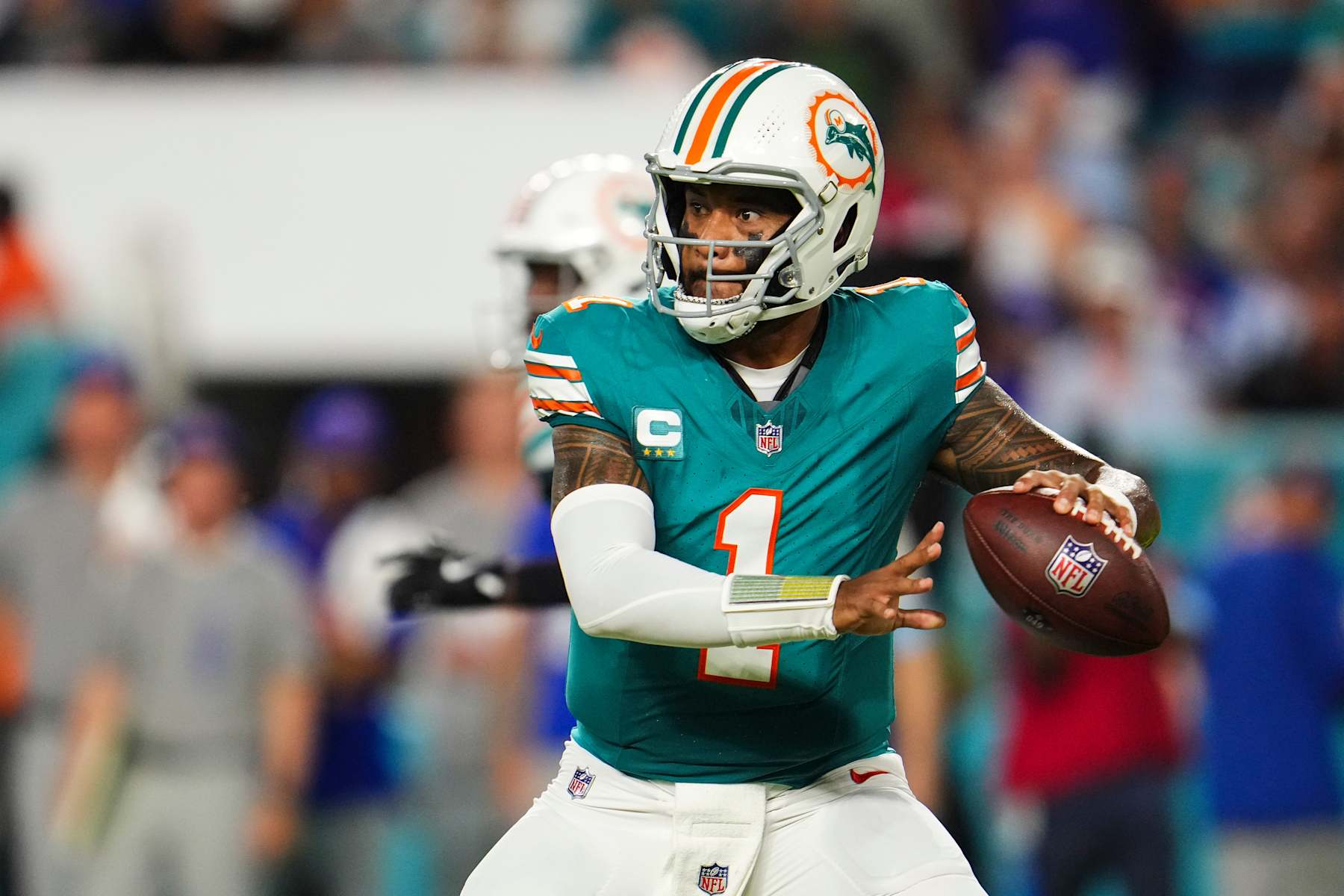 MIAMI GARDENS, FL - SEPTEMBER 12: Tua Tagovailoa #1 of the Miami Dolphins drops back to pass during an NFL football game against the Buffalo Bills at Hard Rock Stadium on September 12, 2024 in Miami Gardens, Florida. (Photo by Cooper Neill/Getty Images)