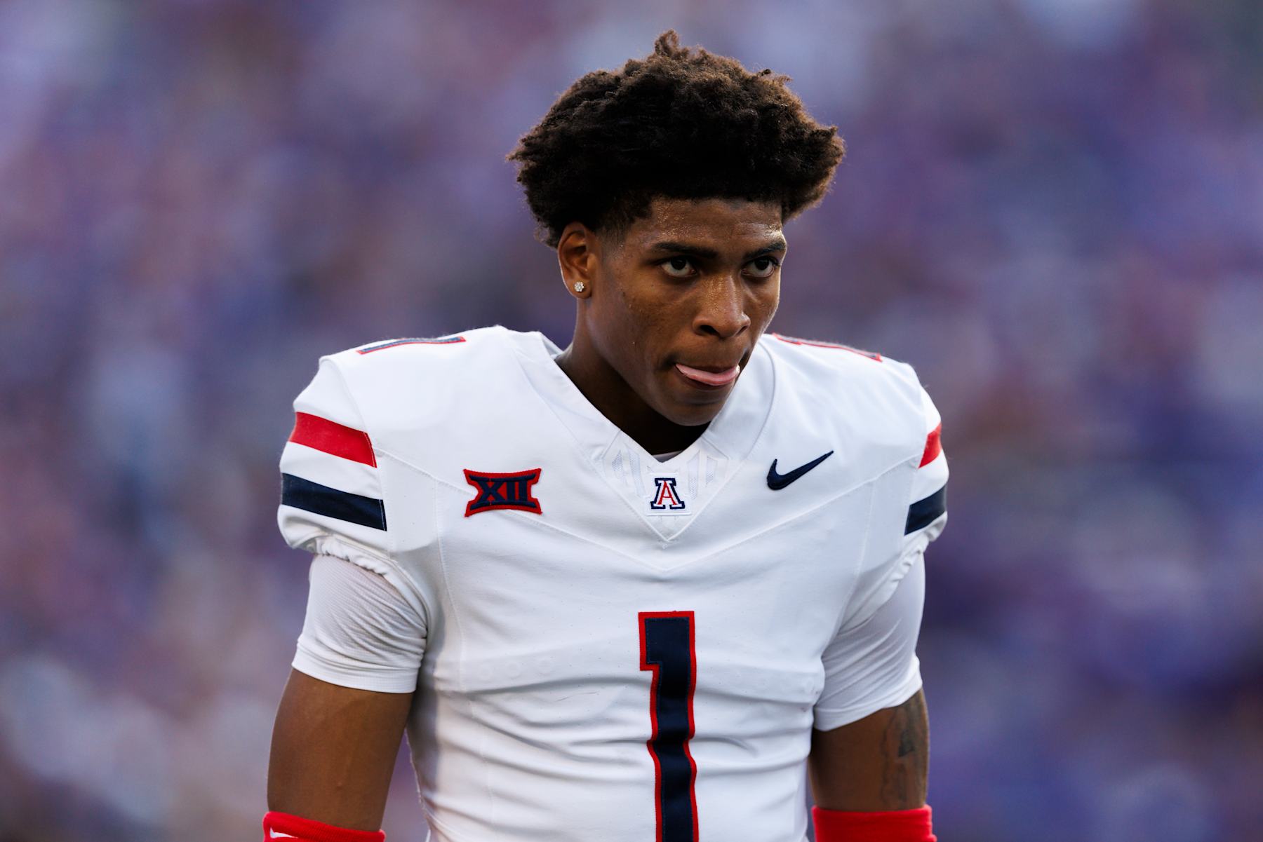MANHATTAN, KANSAS - SEPTEMBER 13: Tacario Davis #1 of the Arizona Wildcats walks off the field before during a game against Kansas State Wildcats at Bill Snyder Family Football Stadium on September 13, 2024 in Manhattan, Kansas. (Photo by Ric Tapia/Getty Images)