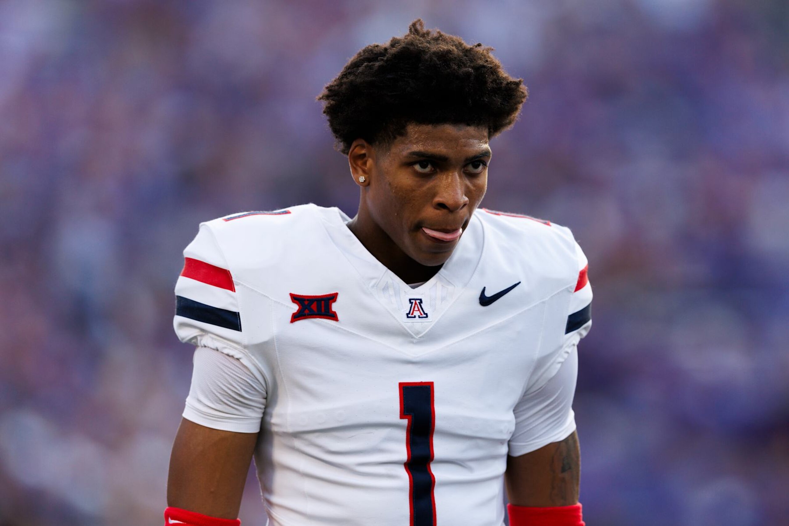 MANHATTAN, KANSAS - SEPTEMBER 13: Tacario Davis #1 of the Arizona Wildcats walks off the field before during a game against Kansas State Wildcats at Bill Snyder Family Football Stadium on September 13, 2024 in Manhattan, Kansas. (Photo by Ric Tapia/Getty Images)