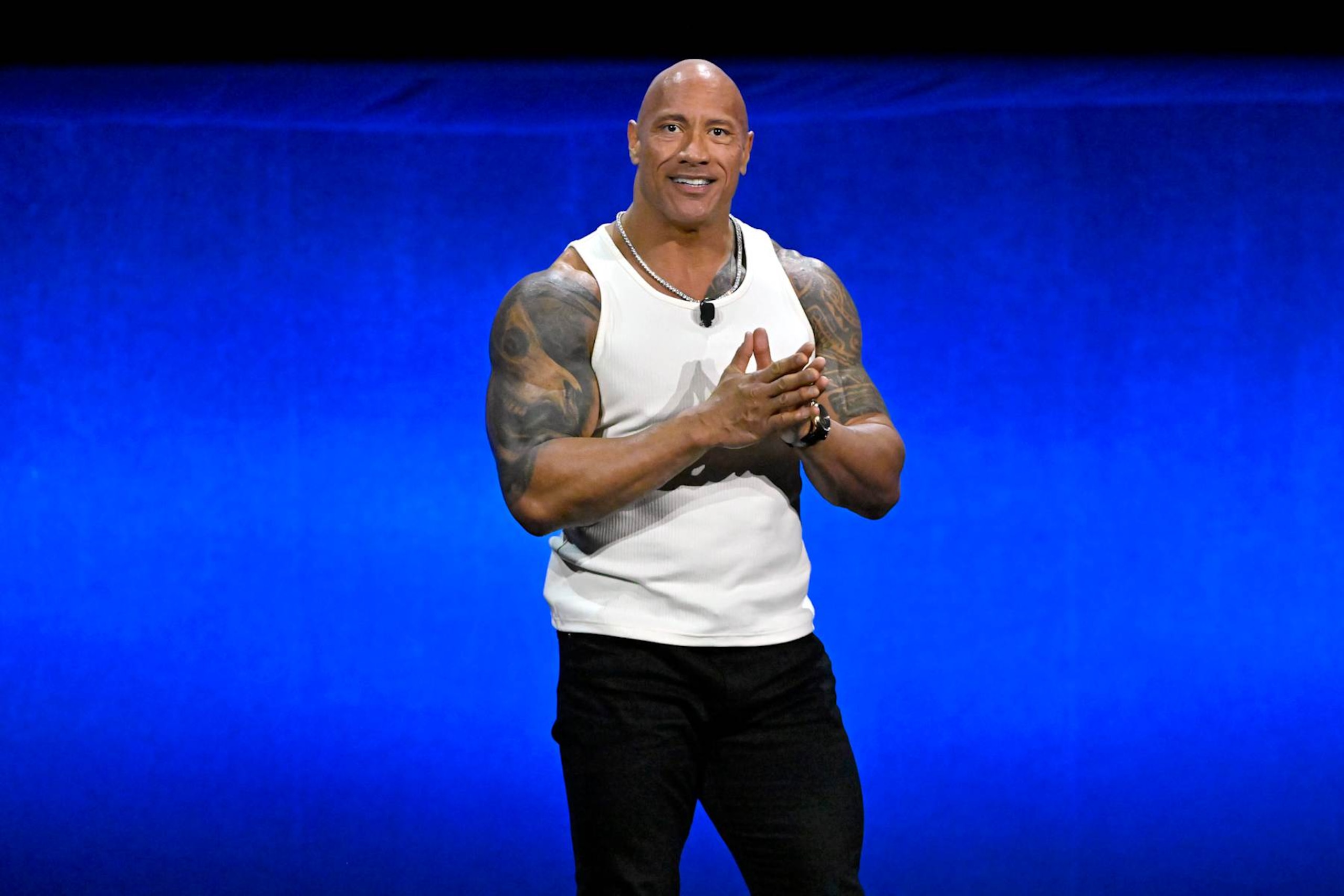LAS VEGAS, NEVADA - APRIL 11: Dwayne Johnson speaks onstage at the Walt Disney Studios Presentation during CinemaCon 2024 at The Colosseum at Caesars Palace on April 11, 2024 in Las Vegas, Nevada.  (Photo by David Becker/WireImage)