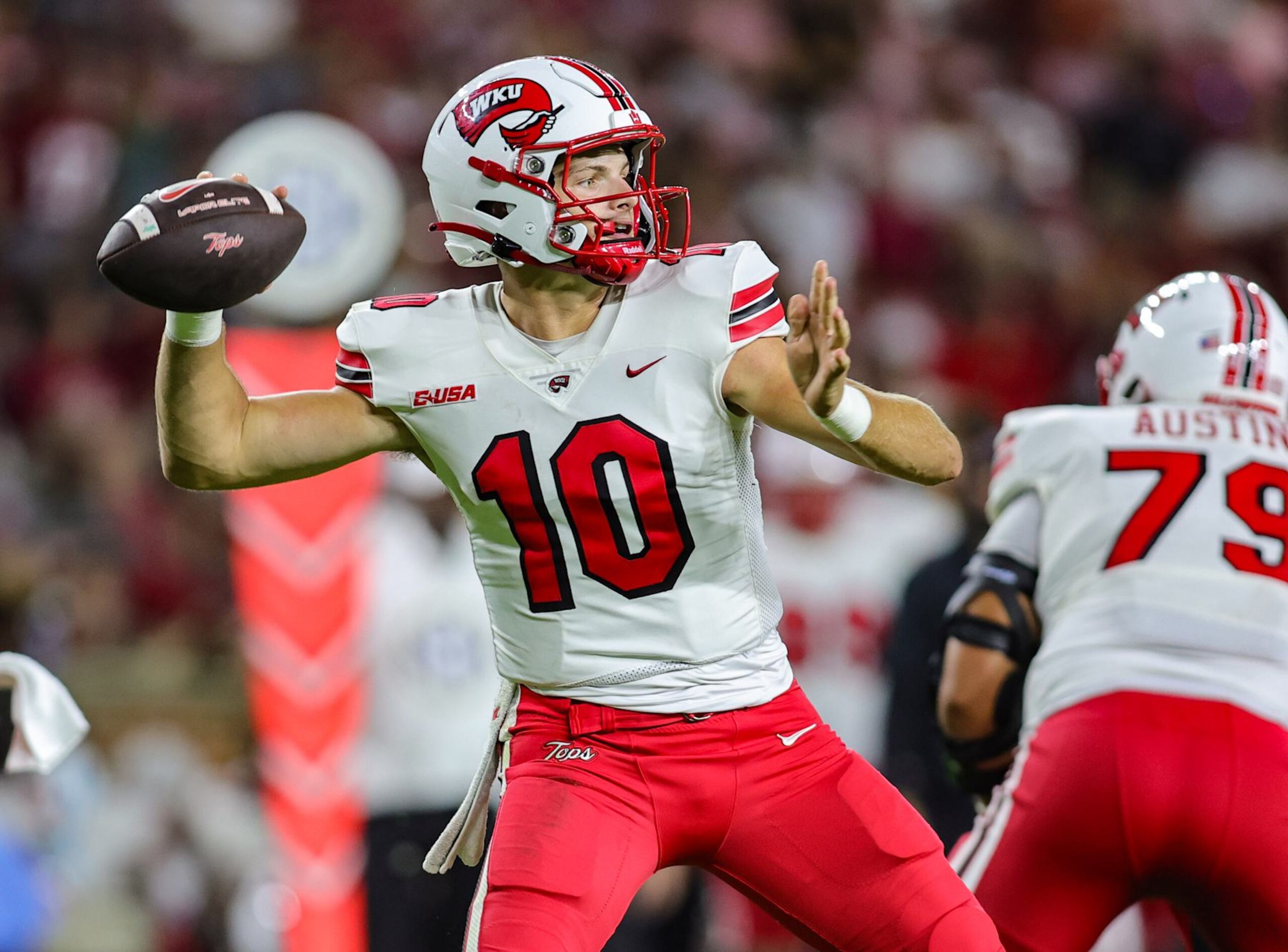 TUSCALOOSA, ALABAMA - AUGUST 31: Caden Veltkamp #10 of the Western Kentucky Hilltoppers drops back to pass during the second half against the Alabama Crimson Tide at Bryant-Denny Stadium on August 31, 2024 in Tuscaloosa, Alabama. (Photo by Brandon Sumrall/Getty Images)