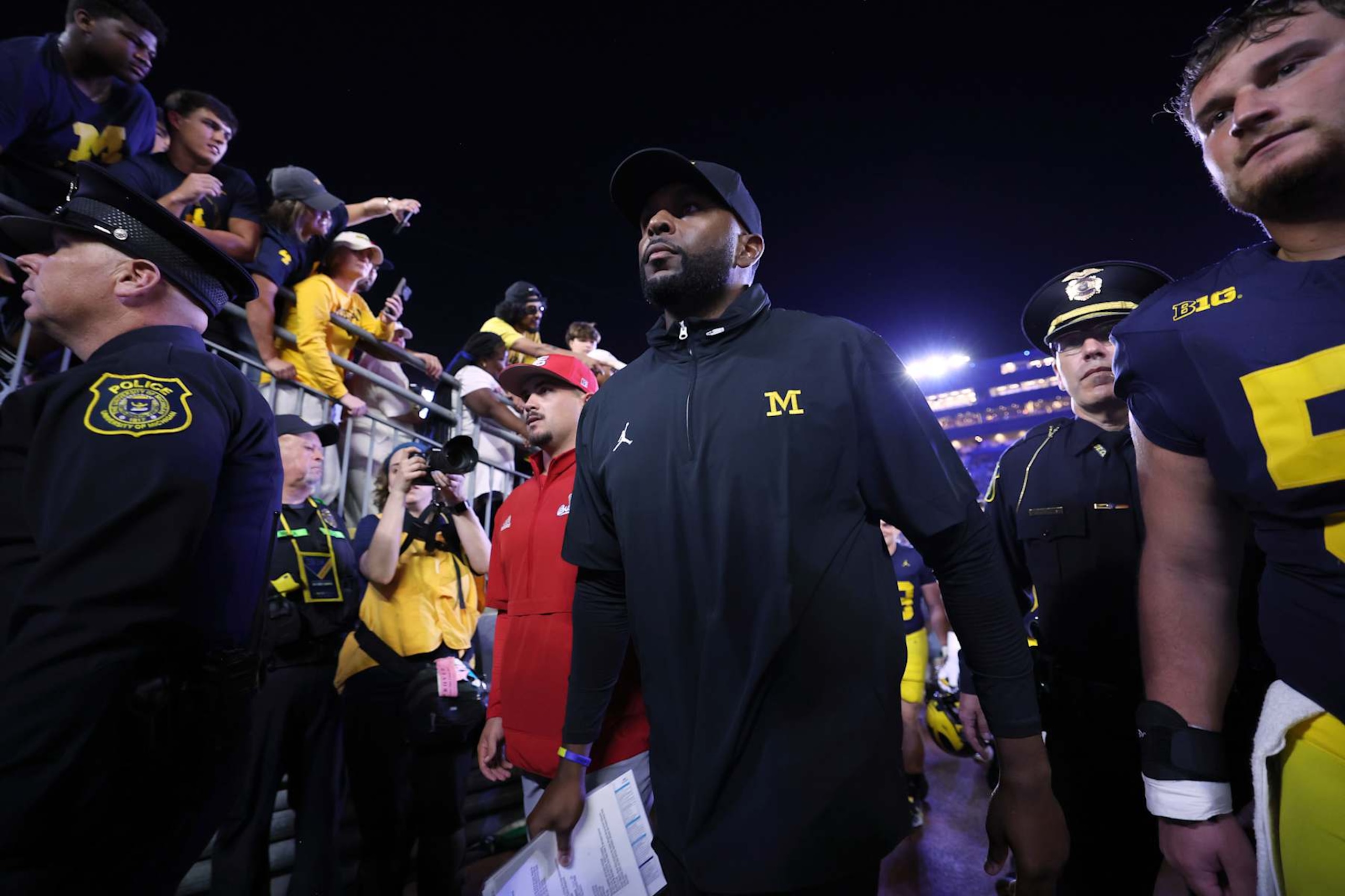 ANN ARBOR, MICHIGAN - AUGUST 31: Head coach Sherrone Moore of the Michigan Wolverines leaves the field after a 30-10 win over the Fresno State Bulldogs at Michigan Stadium on August 31, 2024 in Ann Arbor, Michigan.  (Photo by Gregory Shamus/Getty Images)