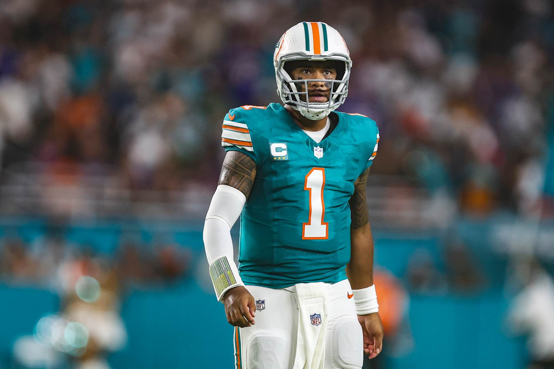 MIAMI GARDENS, FL - SEPTEMBER 12: Tua Tagovailoa #1 of the Miami Dolphins looks on from the field during an NFL football game against the Buffalo Bills at Hard Rock Stadium on September 12, 2024 in Miami Gardens, FL. (Photo by Perry Knotts/Getty Images)