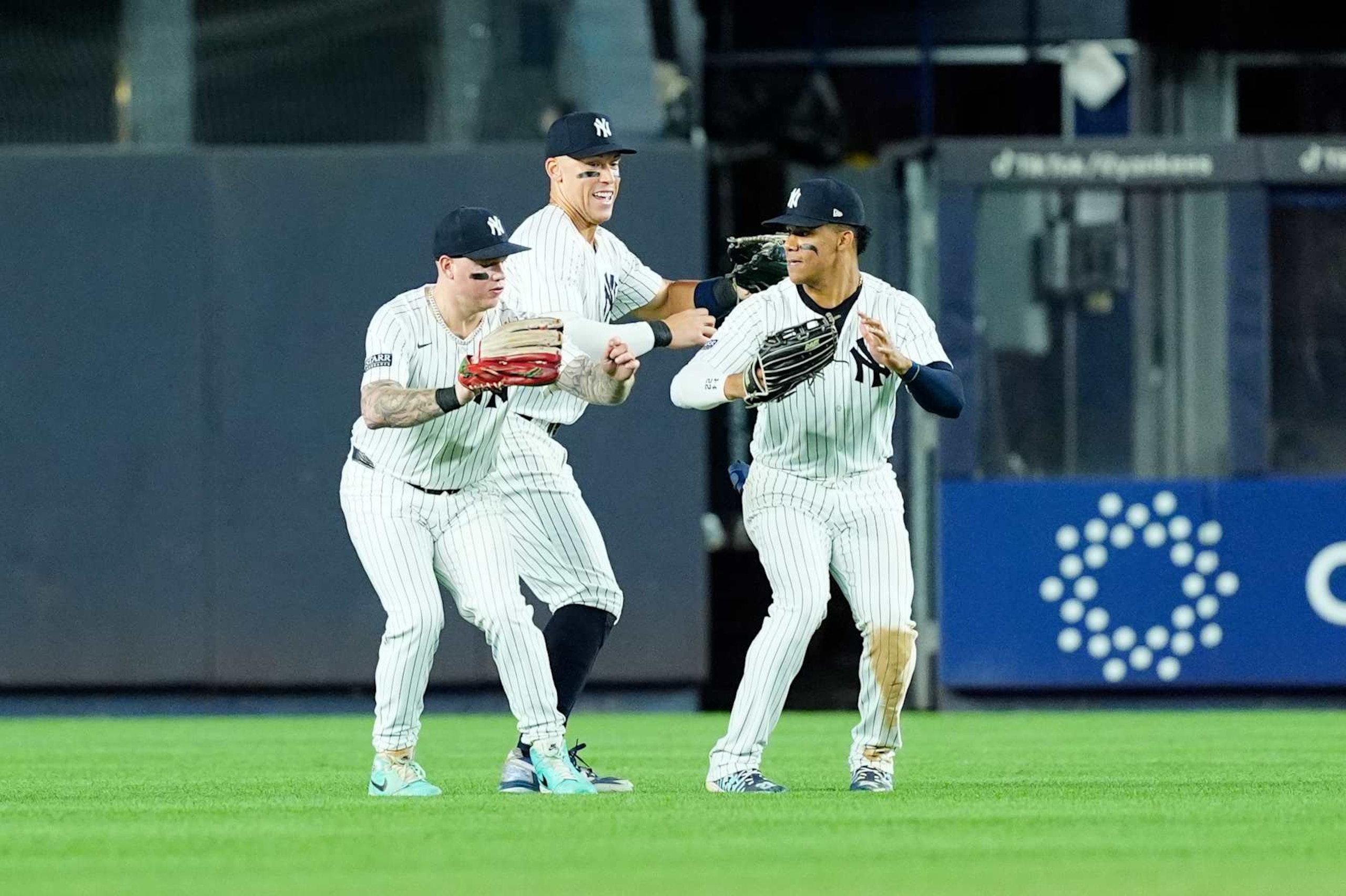 BRONX, NY - AUGUST 30: New York Yankees Left Fielder Alex Verdugo (24) and Center Fielder Aaron Judge (99) and  Right Fielder Juan Soto (22) celebrate the victory after the ninth inning of the Major League Baseball game between the St. Louis Cardinals and the New York Yankees on August 30, 2024, at Yankee Stadium in the Bronx, NY. (Photo by Gregory Fisher/Icon Sportswire via Getty Images)