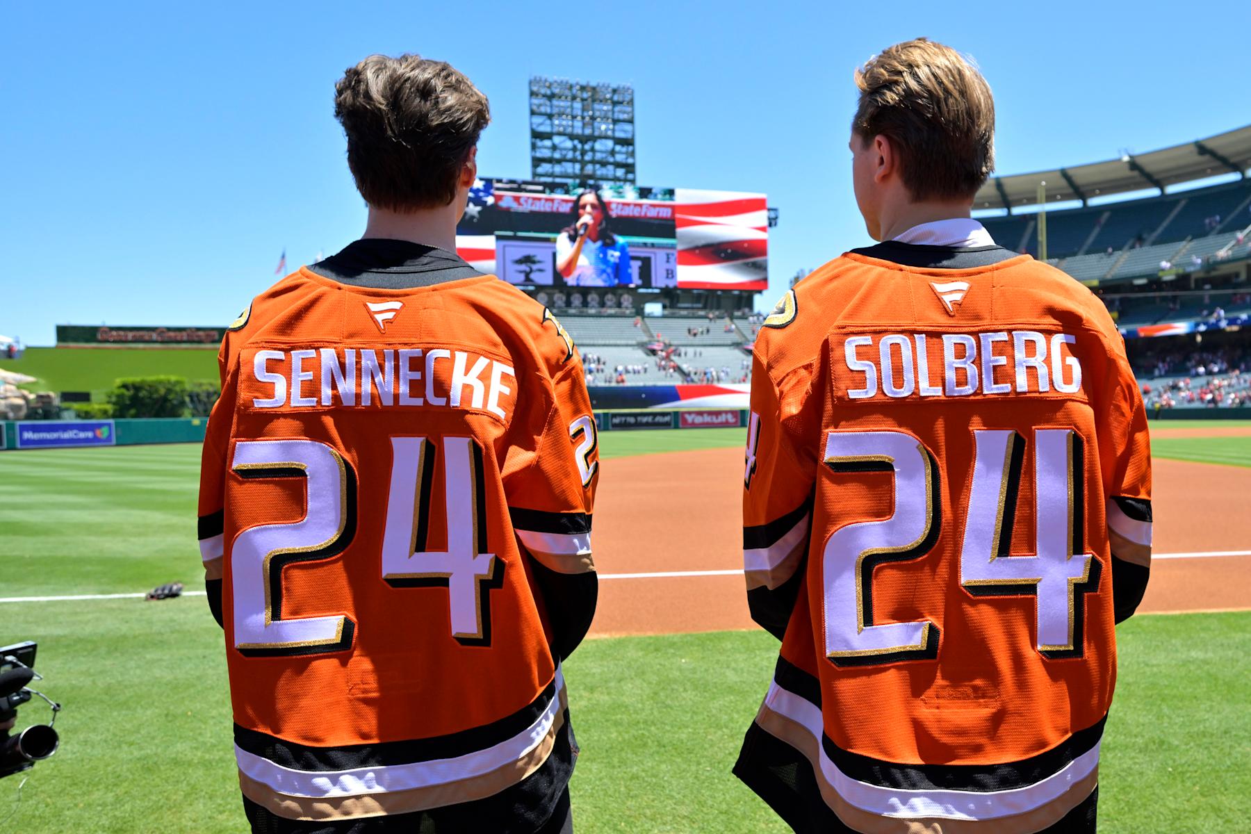 ANAHEIM, CALIFORNIA - JUNE 30: The Anaheim Ducks first round draft picks Beckett Sennecke and Stian Solberg on the field prior to the game between the Los Angeles Angels and the Detroit Tigers at Angel Stadium of Anaheim on June 30, 2024 in Anaheim, California. (Photo by Jayne Kamin-Oncea/Getty Images)