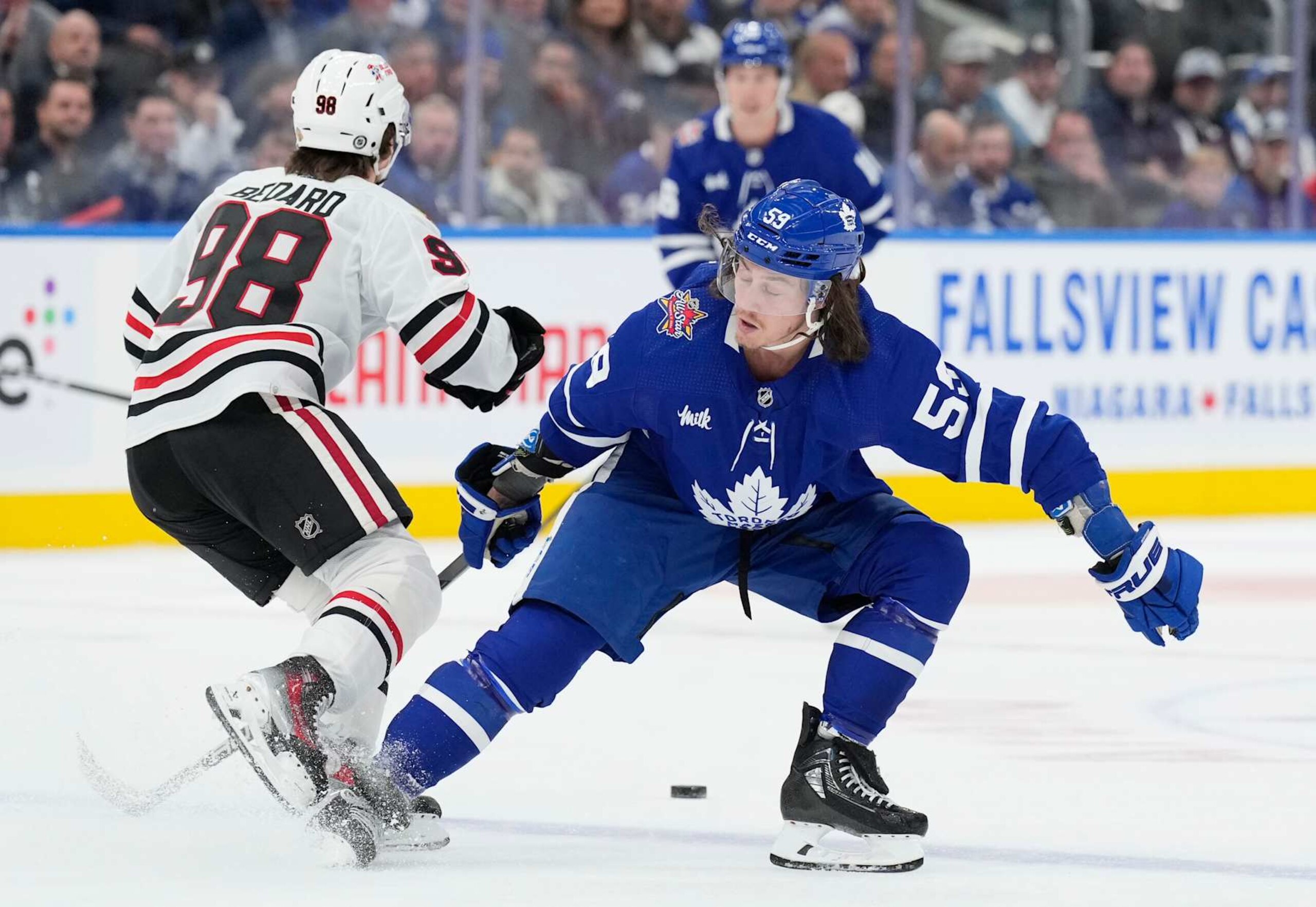 TORONTO, ON - OCTOBER 16: Tyler Bertuzzi #59 of the Toronto Maple Leafs battles for the puck with Connor Bedard #98 of the Chicago Blackhawks during the second period at the Scotiabank Arena on October 16, 2023 in Toronto, Ontario, Canada. (Photo by Kevin Sousa/NHLI via Getty Images) TORONTO, ON - OCTOBER 16: Tyler Bertuzzi #59 of the Toronto Maple Leafs battles for the puck with Connor Bedard #98 of the Chicago Blackhawks during the second period at the Scotiabank Arena on October 16, 2023 in Toronto, Ontario, Canada. (Photo by Kevin Sousa/NHLI via Getty Images)