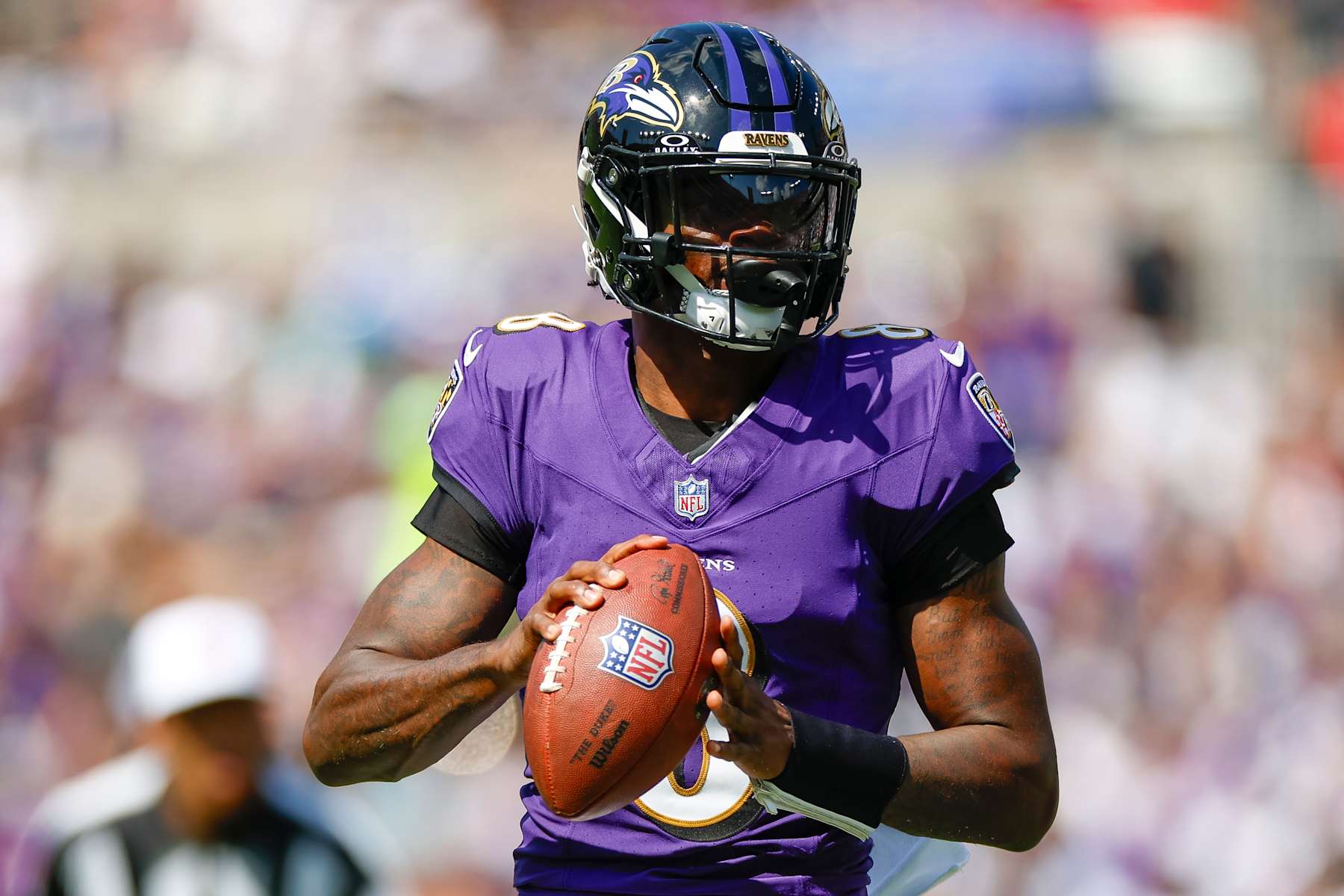 BALTIMORE, MARYLAND - SEPTEMBER 15: Lamar Jackson #8 of the Baltimore Ravens rolls out to throw a pass during the first half against the Las Vegas Raiders at M&T Bank Stadium on September 15, 2024 in Baltimore, Maryland. (Photo by Brandon Sloter/Getty Images)