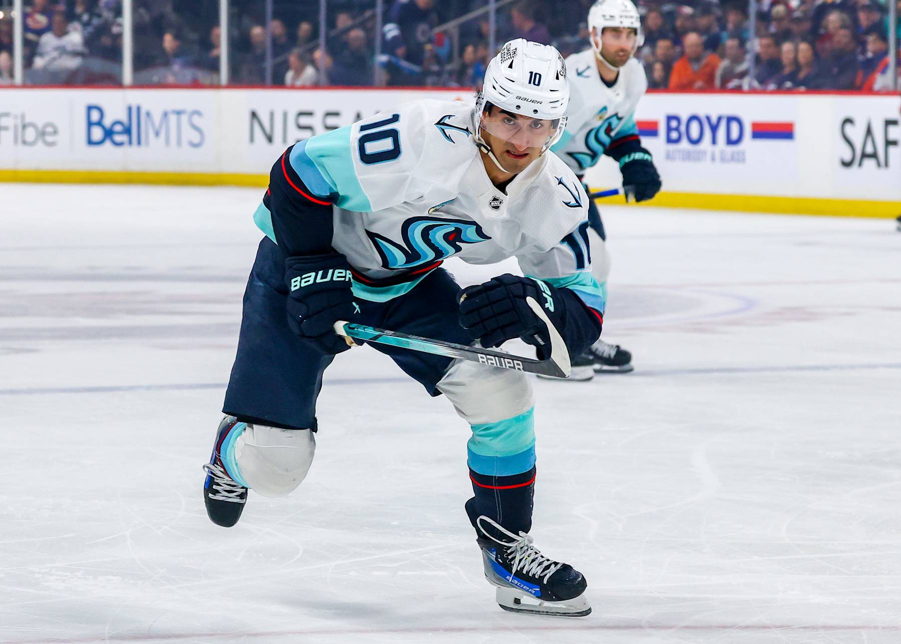 WINNIPEG, CANADA - APRIL 16: Matty Beniers #10 of the Seattle Kraken skates during first period action against the Winnipeg Jets at Canada Life Centre on April 16, 2024 in Winnipeg, Manitoba, Canada. (Photo by Jonathan Kozub/NHLI via Getty Images)