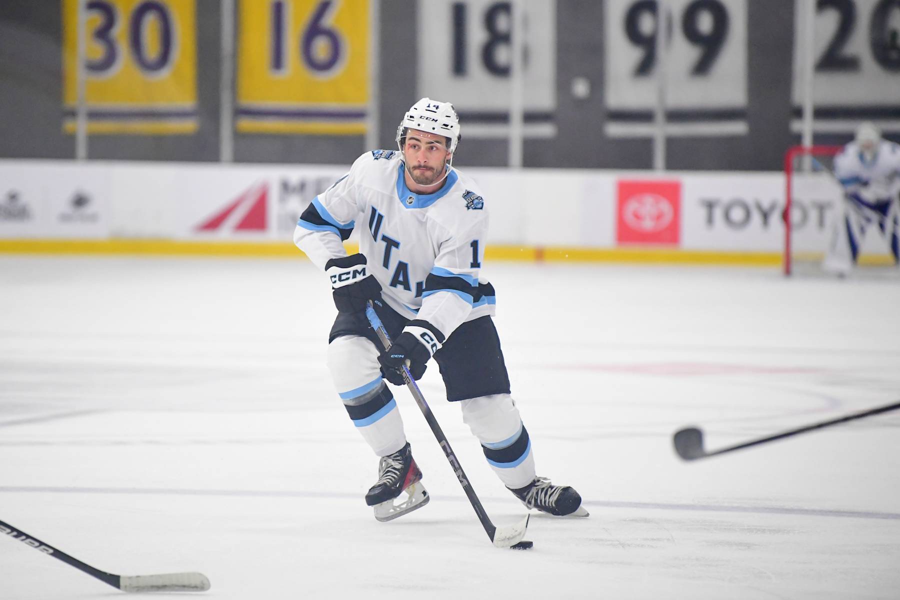 LOS ANGELES, CA - SEPTEMBER 14: Drew Elliott #14 of the Utah Hockey Club skates with the puck during the first period against the Los Angeles Kings at the Toyota Sports Performance Center on September 14, 2024 in Los Angeles, California. (Photo by Gary Vasquez/NHLI via Getty Images)