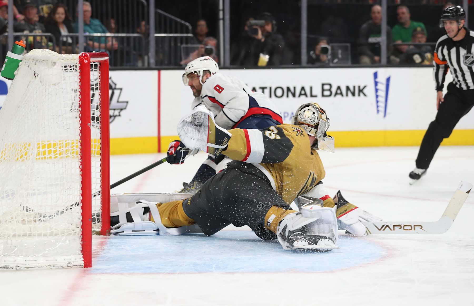 LAS VEGAS, NEVADA - APRIL 20: Logan Thompson #36 of the Vegas Golden Knights defends against a breakaway attempt by Alex Ovechkin #8 of the Washington Capitals during the third period at T-Mobile Arena on April 20, 2022 in Las Vegas, Nevada. (Photo by Zak Krill/NHLI via Getty Images)