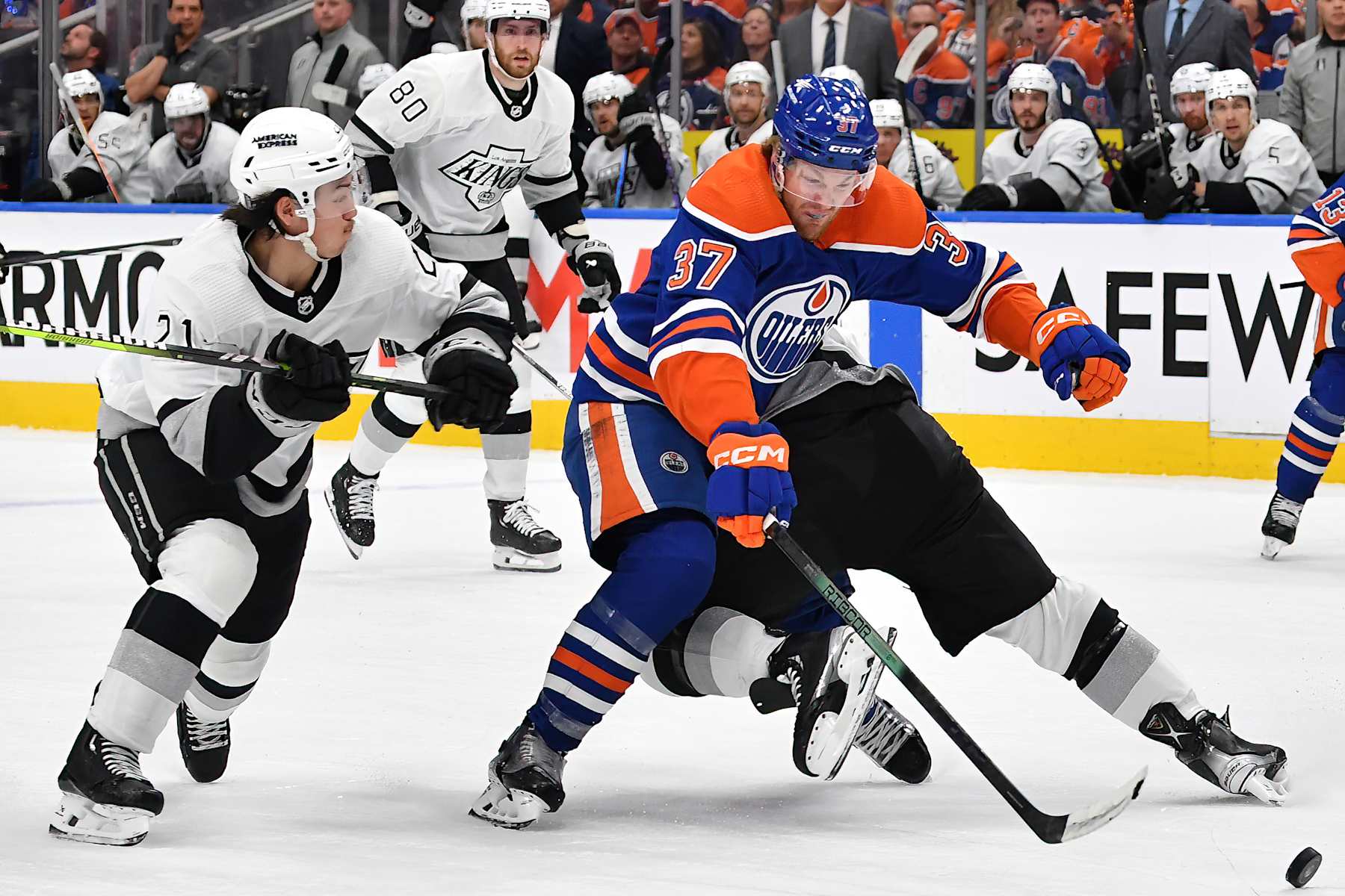 EDMONTON, CANADA - MAY 01: Warren Foegele #37 of the Edmonton Oilers skates against Jordan Spence #21 of the Los Angeles Kings in Game Five of the First Round of the 2024 Stanley Cup Playoffs at Rogers Place on May 1, 2024, in Edmonton, Alberta, Canada. (Photo by Andy Devlin/NHLI via Getty Images)