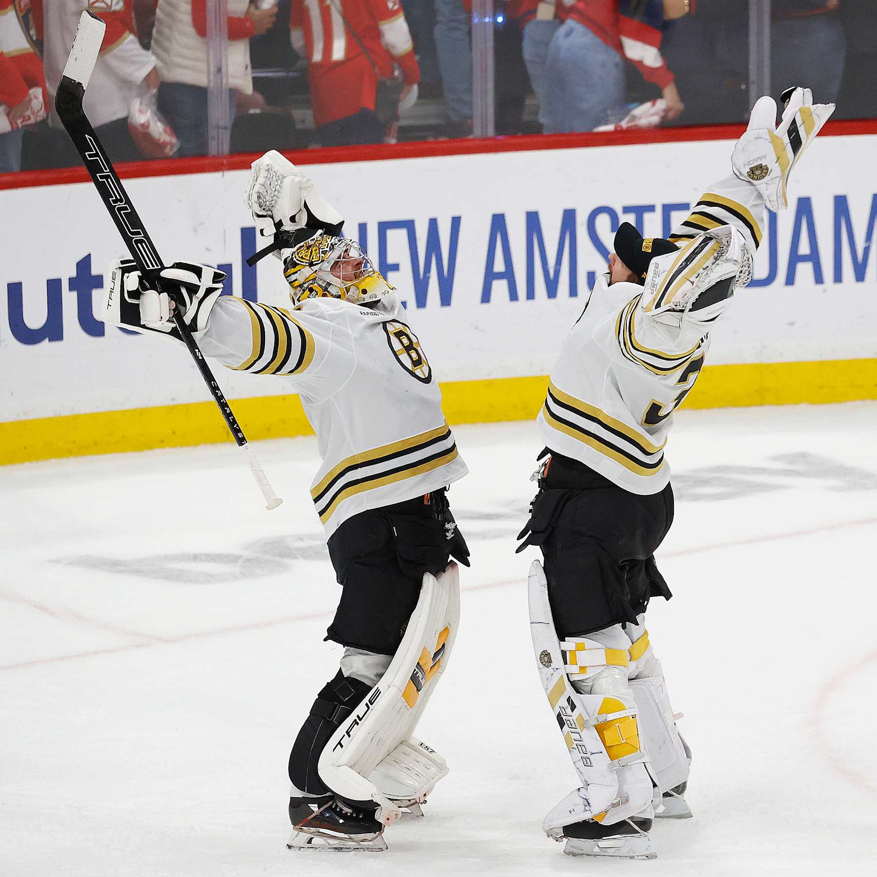 SUNRISE, FLORIDA - MAY 14: Fellow Goaltenders Jeremy Swayman #1 and Linus Ullmark #35 of the Boston Bruins celebrate their 2-1 win over the Florida Panthers in Game Five of the Second Round of the 2024 Stanley Cup Playoffs at the Amerant Bank Arena on May 14, 2024 in Sunrise, Florida. (Photo by Eliot J. Schechter/NHLI via Getty Images)