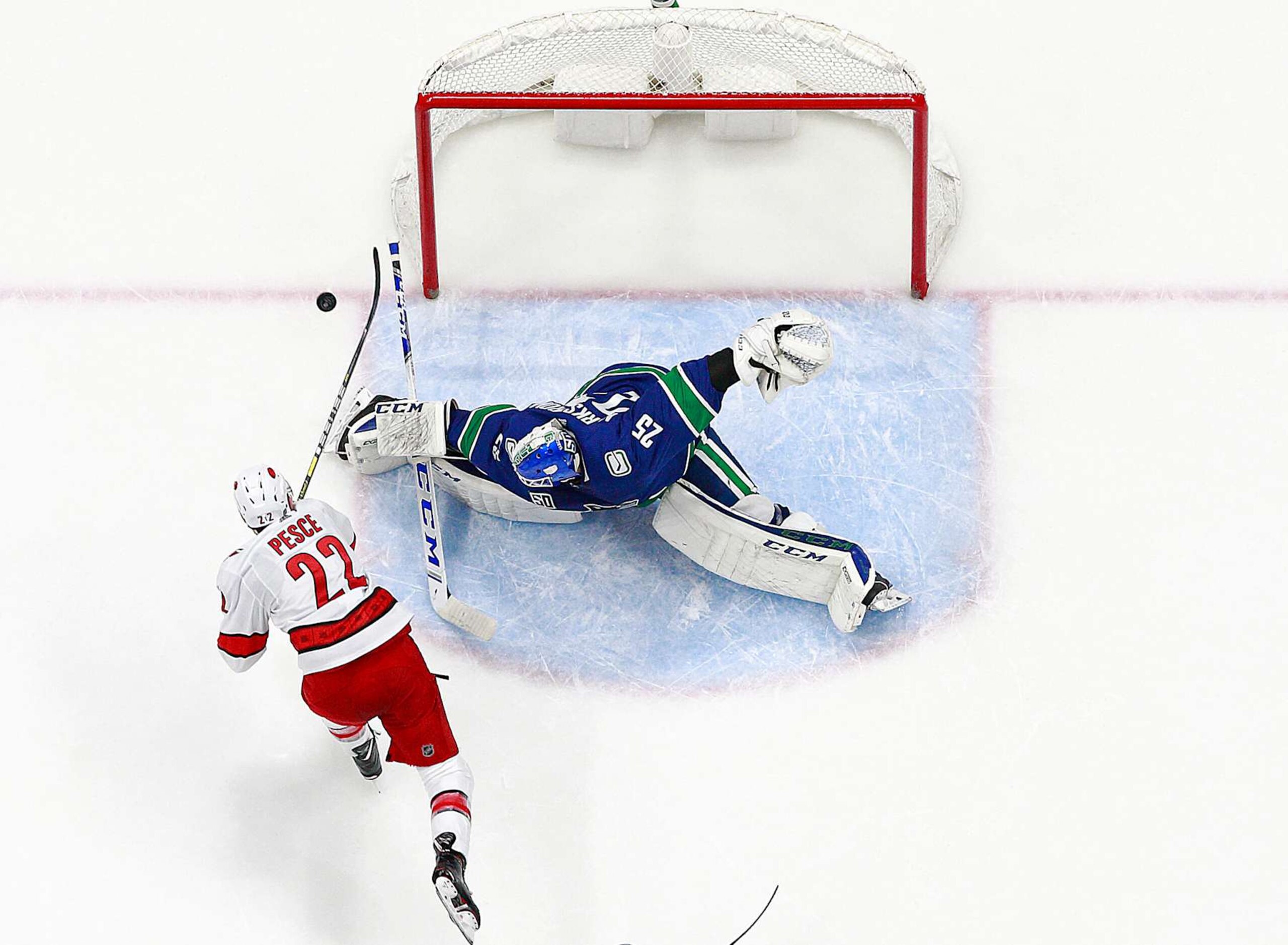 VANCOUVER, BC - DECEMBER 12: Jacob Markstrom #25 of the Vancouver Canucks makes a save against Brett Pesce #22 of the Carolina Hurricanes during their NHL game at Rogers Arena December 12, 2019 in Vancouver, British Columbia, Canada. Vancouver won 1-0. (Photo by Jeff Vinnick/NHLI via Getty Images) VANCOUVER, BC - DECEMBER 12: Jacob Markstrom #25 of the Vancouver Canucks makes a save against Brett Pesce #22 of the Carolina Hurricanes during their NHL game at Rogers Arena December 12, 2019 in Vancouver, British Columbia, Canada. Vancouver won 1-0. (Photo by Jeff Vinnick/NHLI via Getty Images)