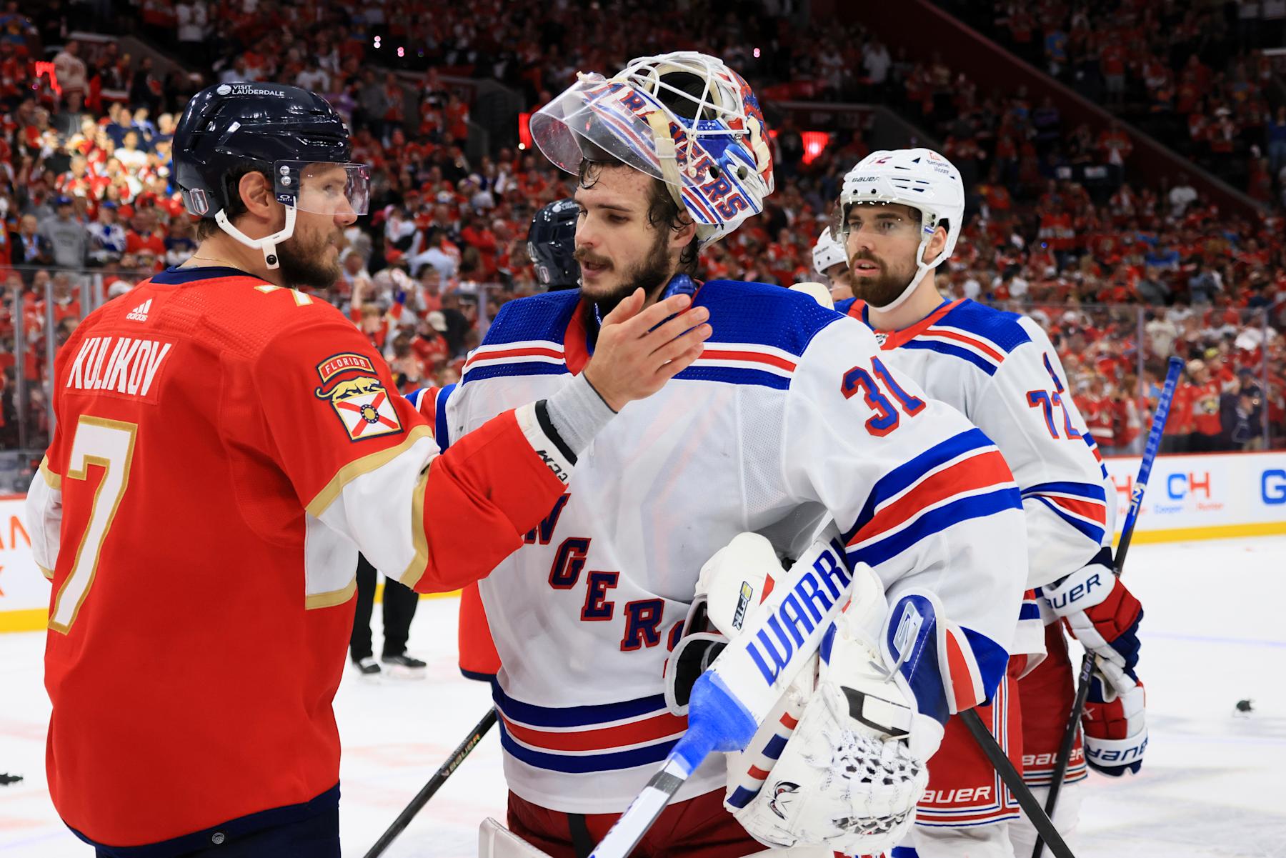 SUNRISE, FLORIDA - JUNE 01: Dmitry Kulikov #7 of the Florida Panthers shakes hands with Igor Shesterkin #31 of the New York Rangers following Game Six of the Eastern Conference Final of the 2024 Stanley Cup Playoffs at Amerant Bank Arena on June 01, 2024 in Sunrise, Florida. (Photo by Bruce Bennett/Getty Images)