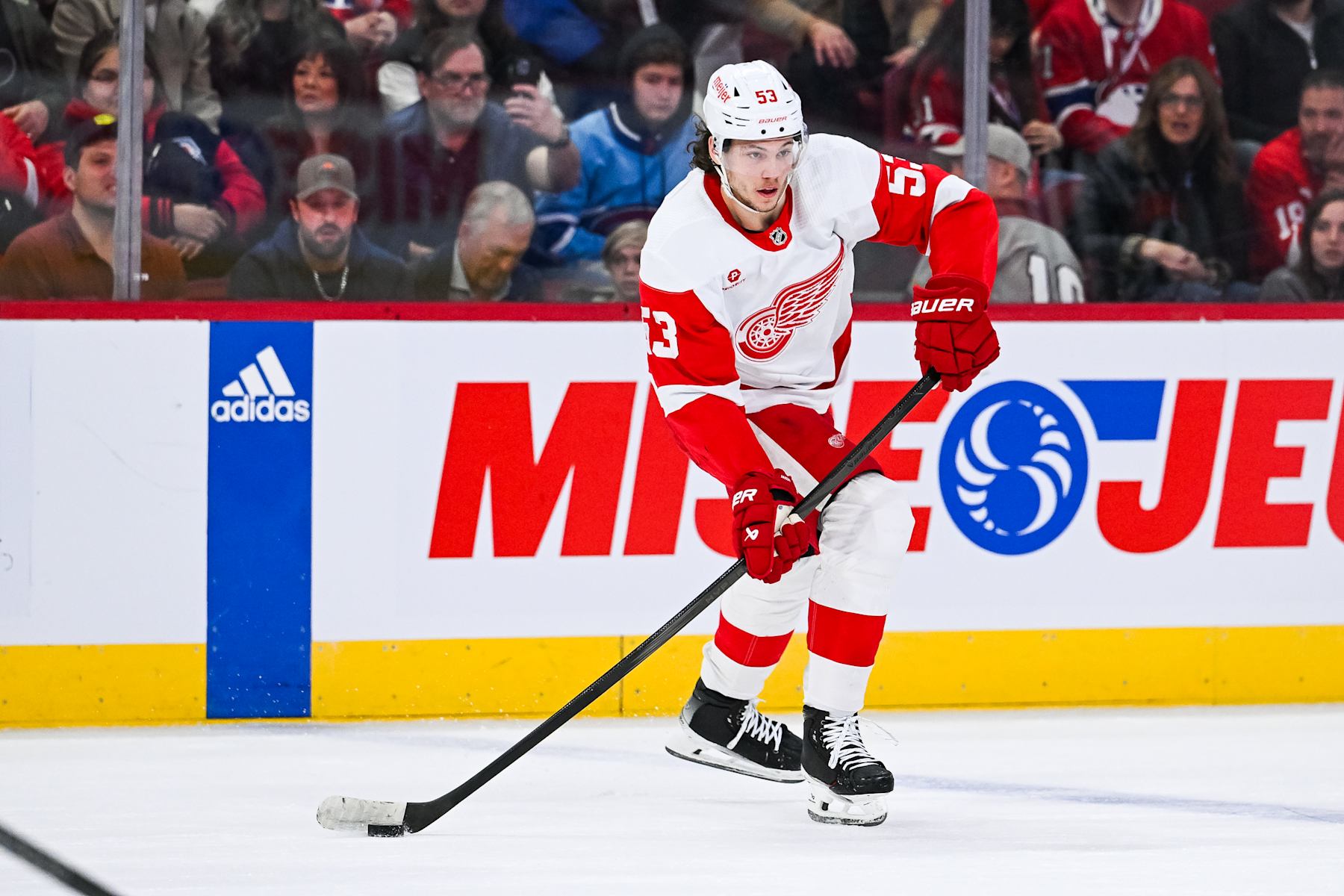 MONTREAL, QC - APRIL 16: Detroit Red Wings defenseman Moritz Seider (53) plays the puck during the Detroit Red Wings versus the Montreal Canadiens game on April 16, 2024, at Bell Centre in Montreal, QC (Photo by David Kirouac/Icon Sportswire via Getty Images)