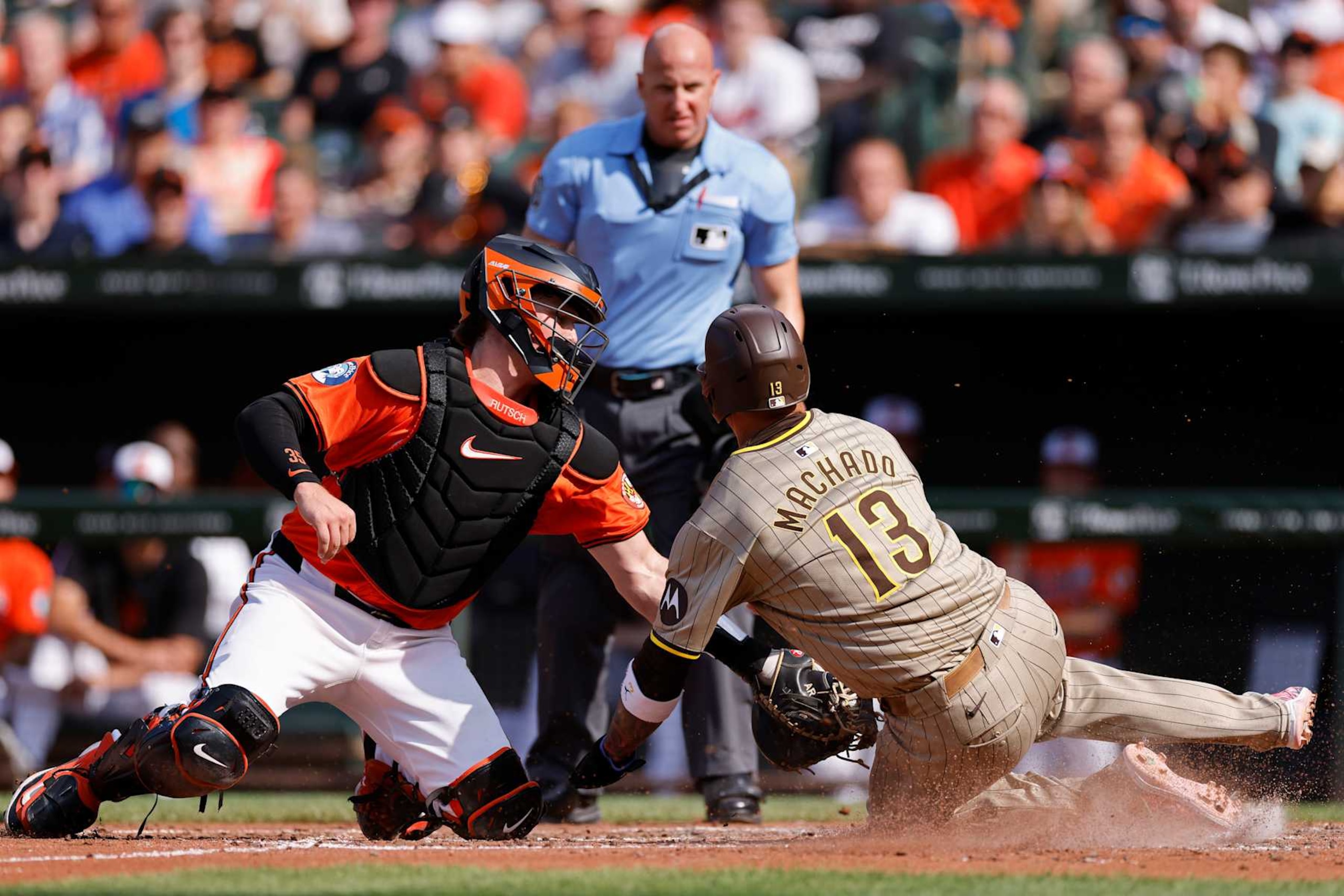 Adley Rutschman, left, and Manny Machado.