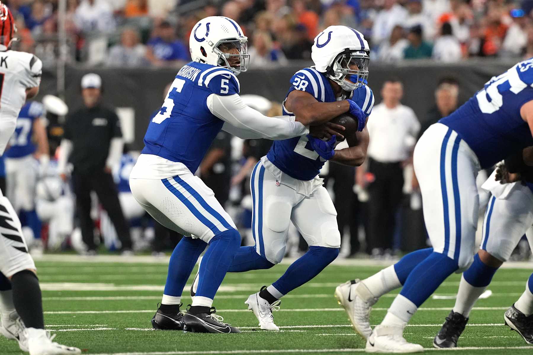 CINCINNATI, OHIO - AUGUST 22: Quarterback Anthony Richardson #5 of the Indianapolis Colts hands the ball off to running back Jonathan Taylor #28 of the Indianapolis Colts during the preseason game against the Indianapolis Colts at Paycor Stadium on August 22, 2024 in Cincinnati, Ohio.  (Photo by Jason Mowry/Getty Images)