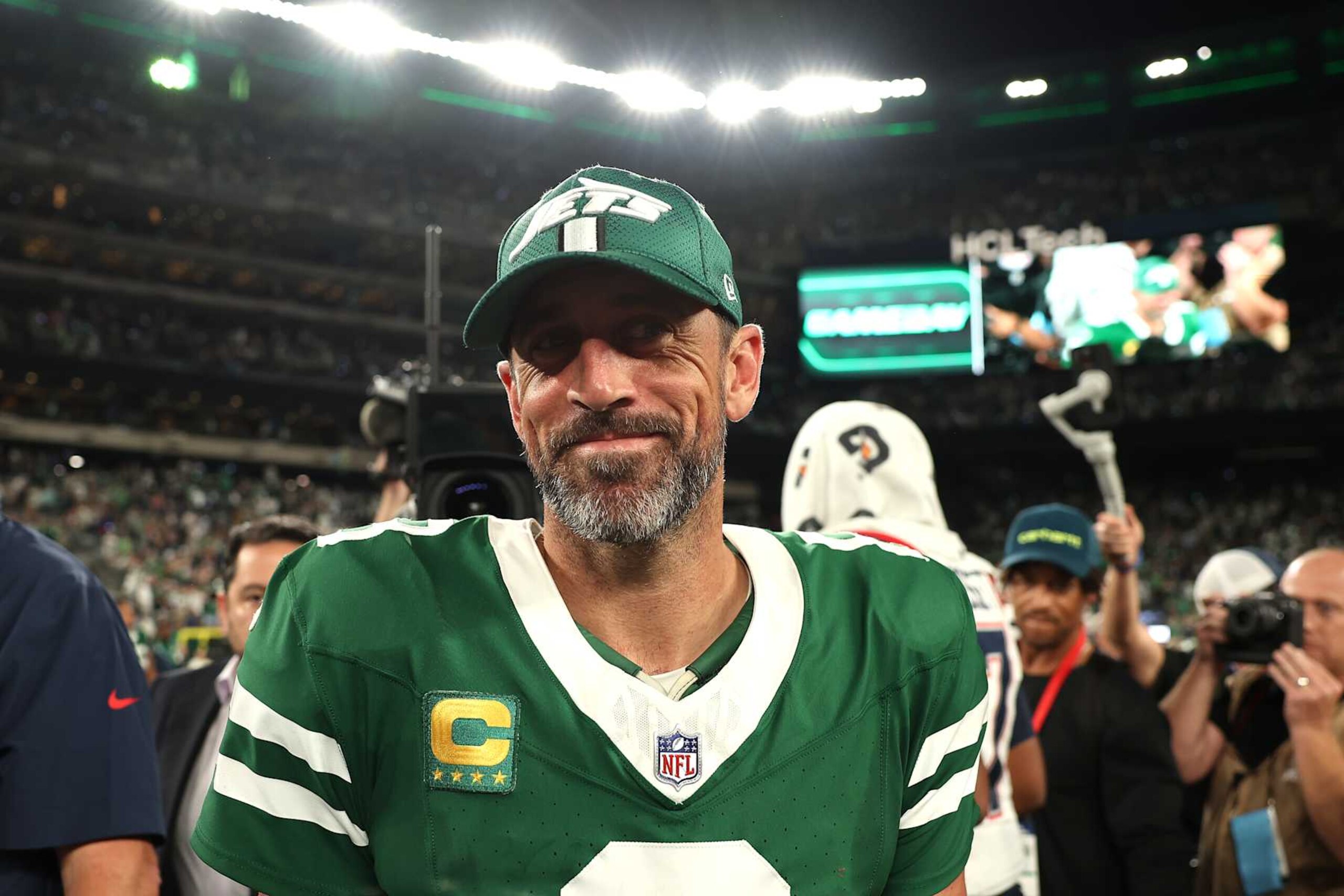 EAST RUTHERFORD, NEW JERSEY - SEPTEMBER 19: Aaron Rodgers #8 of the New York Jets smiles after defeating the New England Patriots in the game at MetLife Stadium on September 19, 2024 in East Rutherford, New Jersey. (Photo by Sarah Stier/Getty Images)