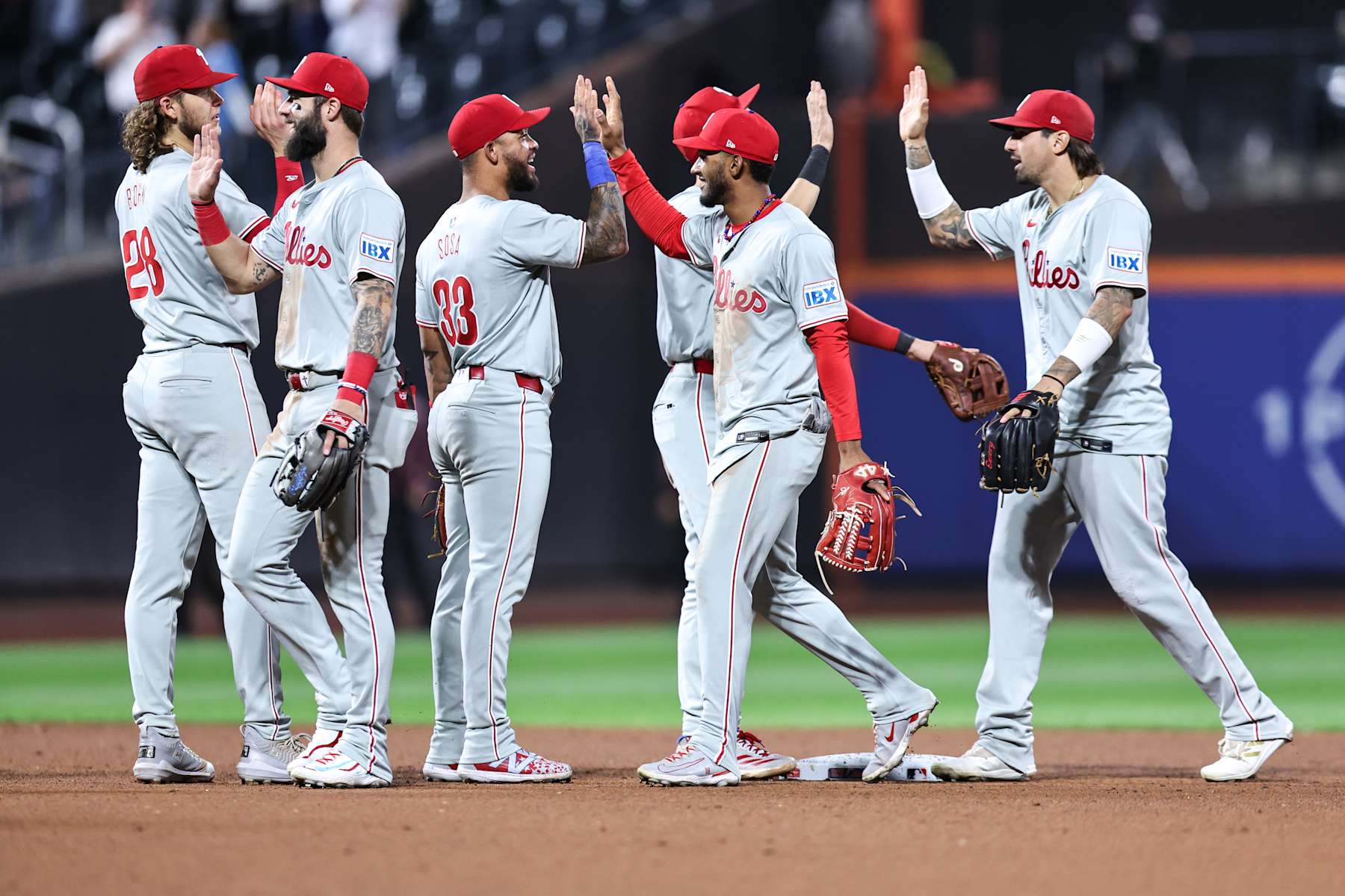 NEW YORK, NEW YORK - SEPTEMBER 20: The Philadelphia Phillies celebrate after defeating the New York Mets 12-2 in a game at Citi Field on September 20, 2024 in New York City. (Photo by Dustin Satloff/Getty Images)