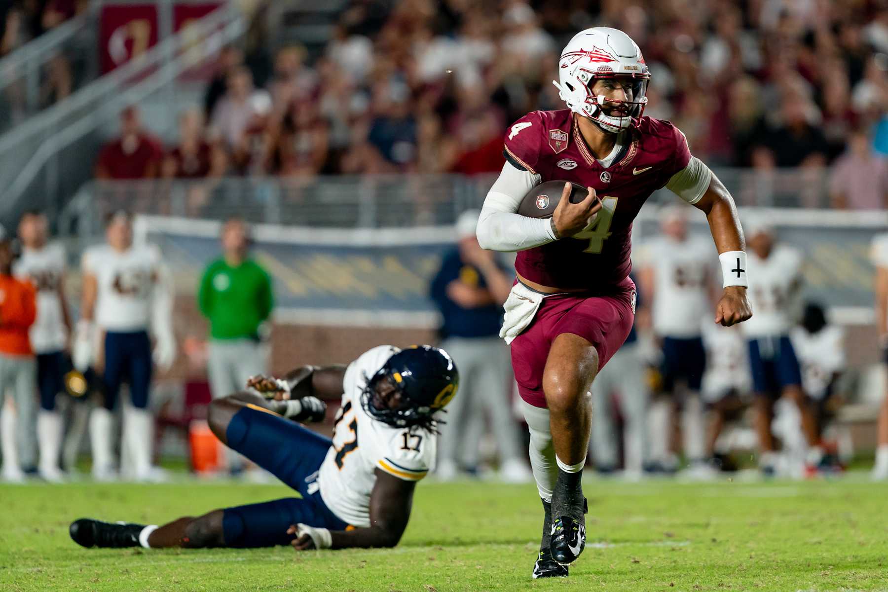 TALLAHASSEE, FL - SEPTEMBER 21:Florida State Seminoles quarterback DJ Uiagalelei (4) scrambles during a college football game between the California Golden Bears and the Florida State Seminoles on September 21st, 2024 at Doak Campbell Stadium in Tallahassee, FL. (Photo by Chris Leduc/Icon Sportswire via Getty Images)