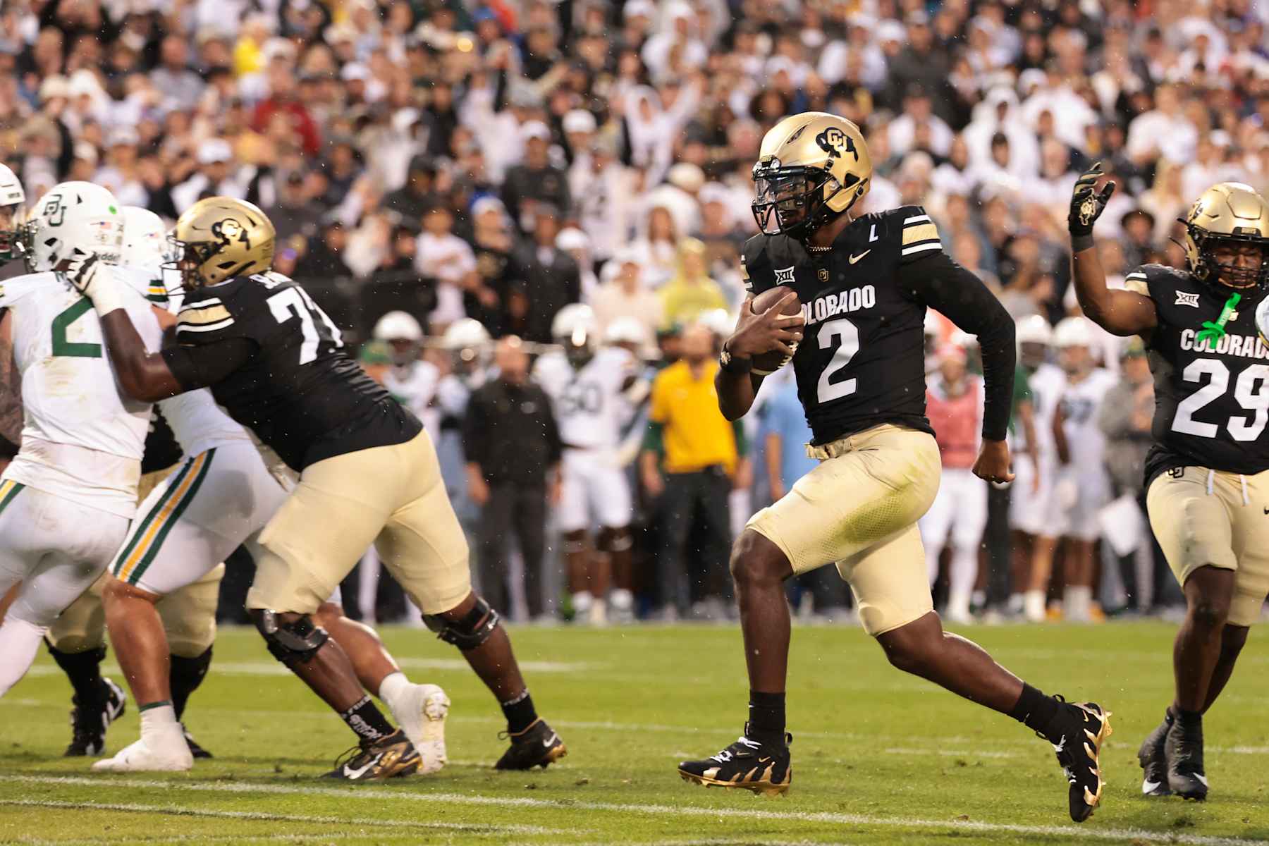 BOULDER, COLORADO - SEPTEMBER 21: Shedeur Sanders #2 of the Colorado Buffaloes runs with the ball for a touchdown during the first quarter against the Baylor Bears at Folsom Field on September 21, 2024 in Boulder, Colorado. (Photo by Andrew Wevers/Getty Images)