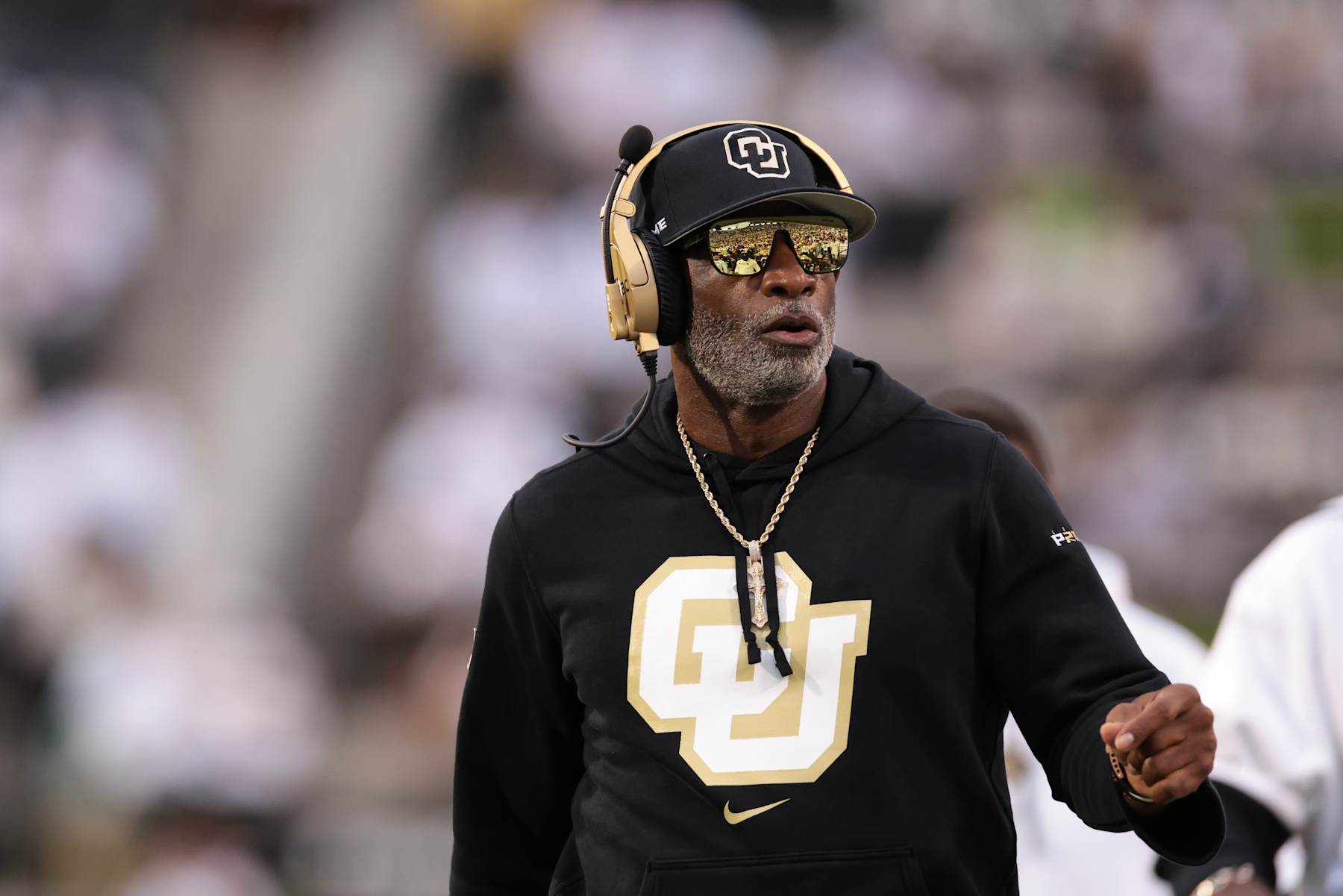 BOULDER, COLORADO - SEPTEMBER 21: Head coach Deion Sanders of the Colorado Buffaloes runs on the field during the first quarter  against the Baylor Bears at Folsom Field on September 21, 2024 in Boulder, Colorado. (Photo by Andrew Wevers/Getty Images)