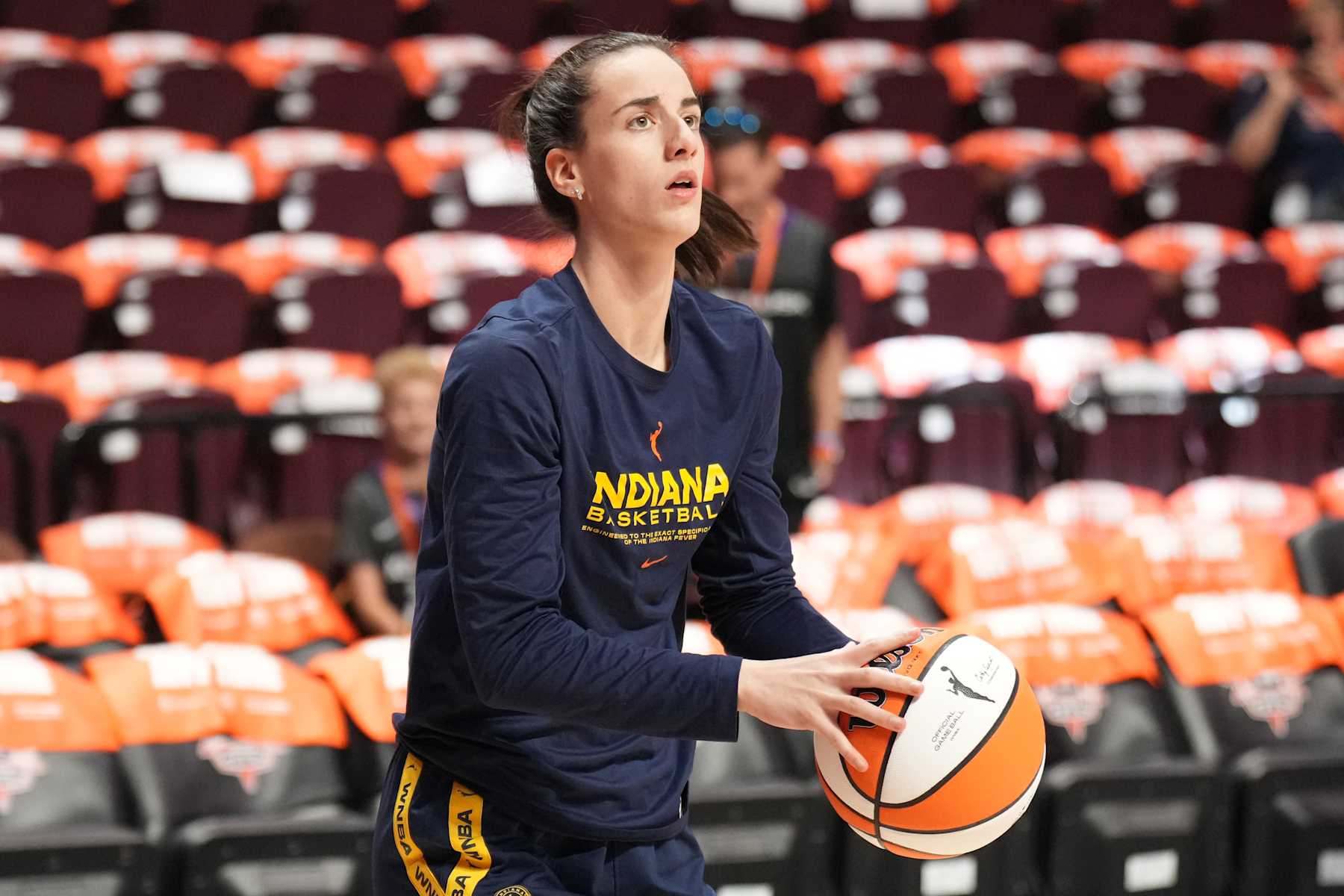 UNCASVILLE, CT - SEPTEMBER 22: Caitlin Clark #22 of the Indiana Fever warms up before the game against the Connecticut Sun during round one game one of the 2024 WNBA Playoffs on September 22, 2024 at the Mohegan Sun Arena in Uncasville, Connecticut. NOTE TO USER: User expressly acknowledges and agrees that, by downloading and or using this photograph, User is consenting to the terms and conditions of the Getty Images License Agreement. Mandatory Copyright Notice: Copyright 2024 NBAE (Photo by Jesse D. Garrabrant/NBAE via Getty Images)