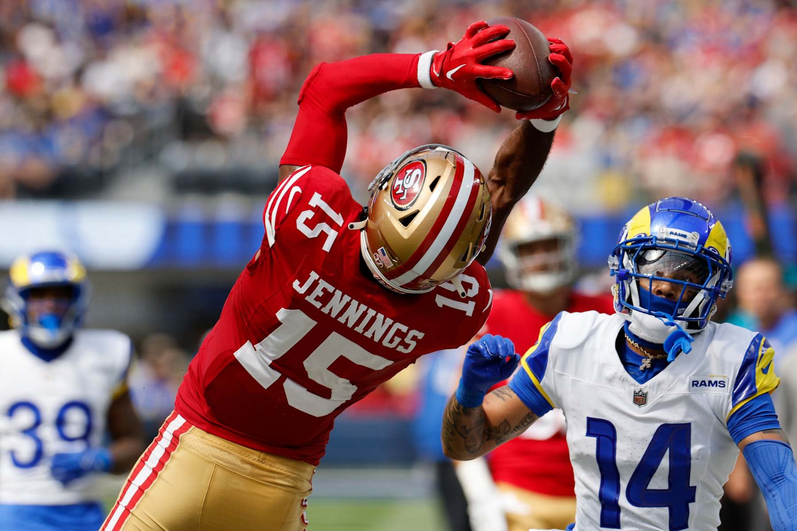 INGLEWOOD, CALIFORNIA - SEPTEMBER 22: Jauan Jennings #15 of the San Francisco 49ers catches a pass for a first down against Cobie Durant #14 of the Los Angeles Rams during the first quarter at SoFi Stadium on September 22, 2024 in Inglewood, California. (Photo by Kevork Djansezian/Getty Images) INGLEWOOD, CALIFORNIA - SEPTEMBER 22: Jauan Jennings #15 of the San Francisco 49ers catches a pass for a first down against Cobie Durant #14 of the Los Angeles Rams during the first quarter at SoFi Stadium on September 22, 2024 in Inglewood, California. (Photo by Kevork Djansezian/Getty Images)