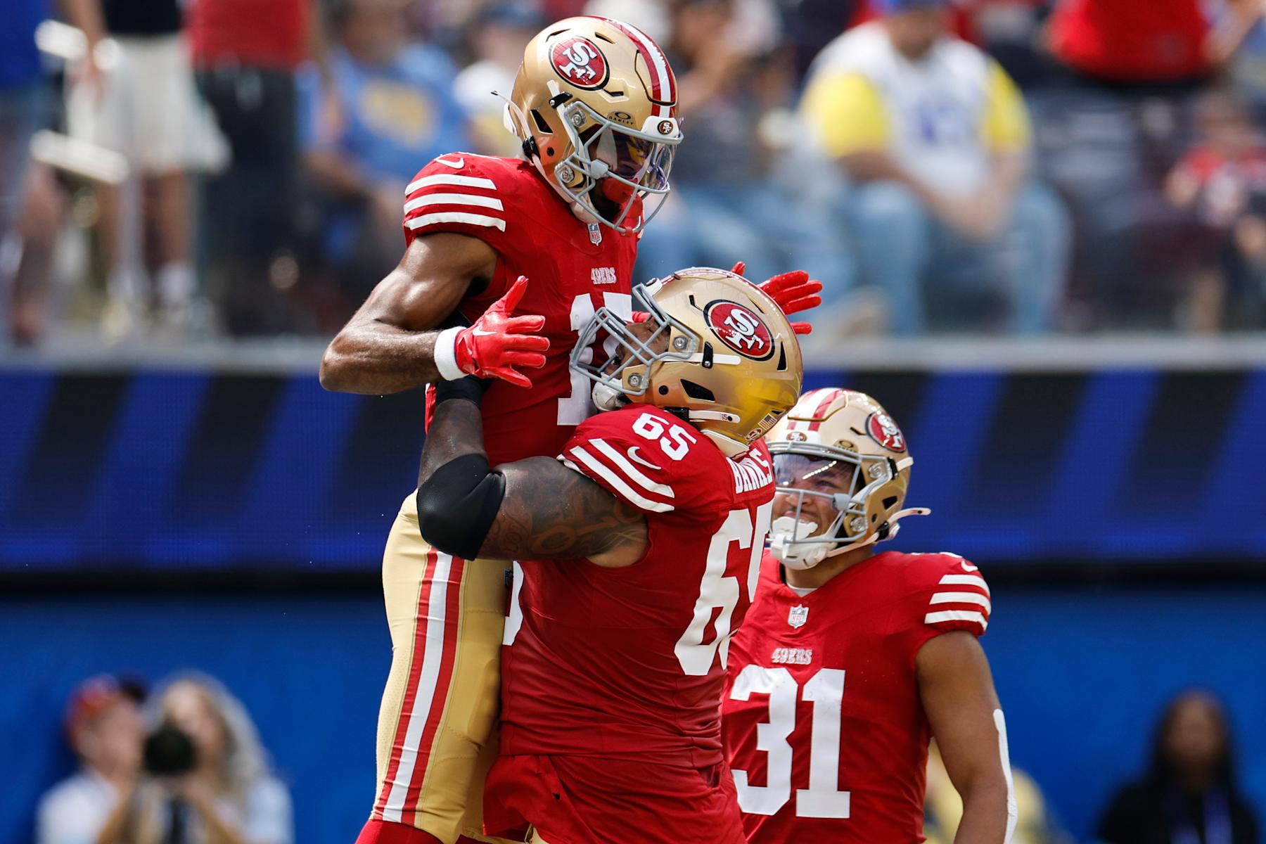 INGLEWOOD, CALIFORNIA - SEPTEMBER 22: Jauan Jennings #15 of the San Francisco 49ers celebrates a touchdown with teammate Aaron Banks #65 of the San Francisco 49ers against the Los Angeles Rams during the first quarter at SoFi Stadium on September 22, 2024 in Inglewood, California. (Photo by Kevork Djansezian/Getty Images)