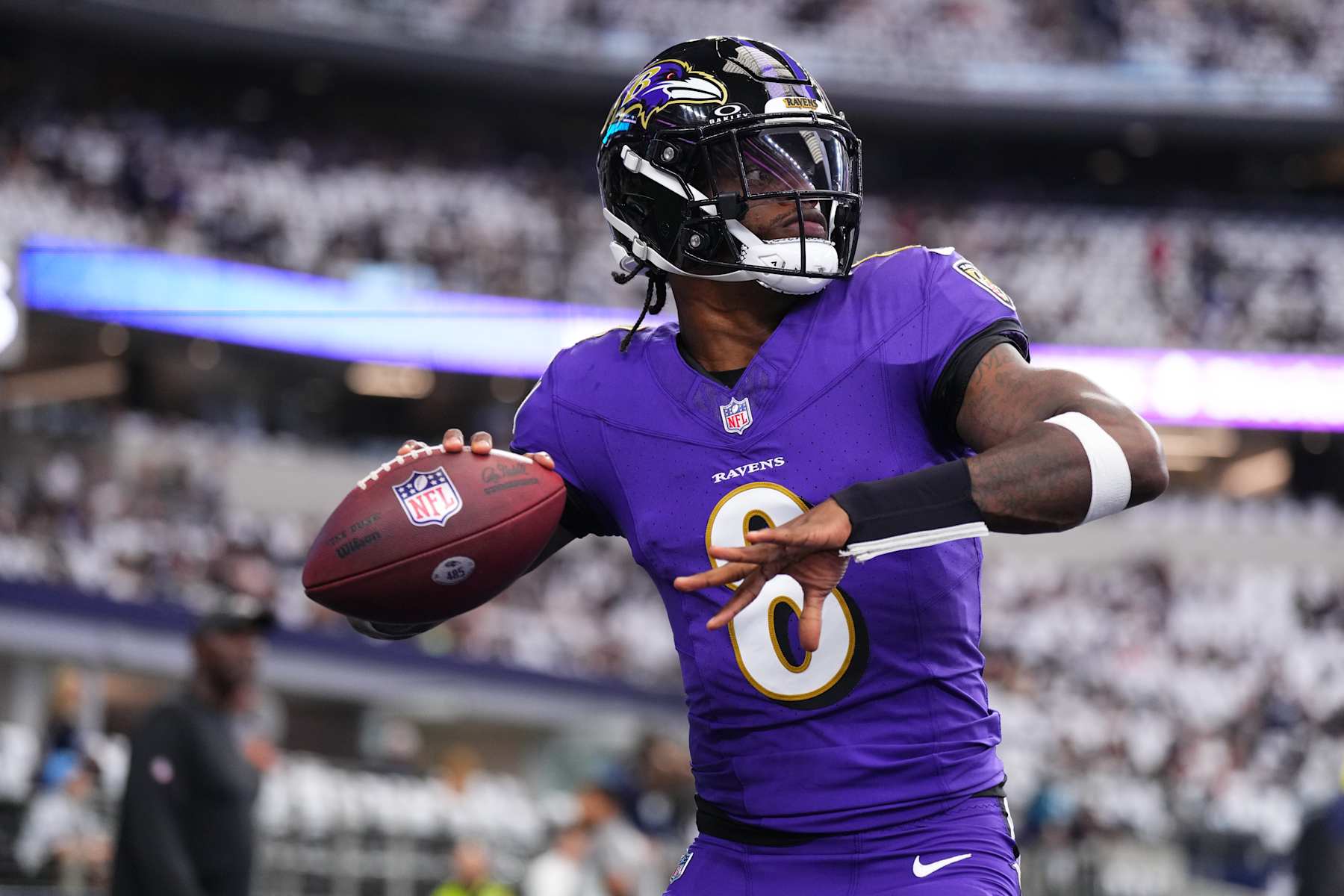 ARLINGTON, TX - SEPTEMBER 22: Lamar Jackson #8 of the Baltimore Ravens warms up before kickoff against the Dallas Cowboys during an NFL football game at AT&T Stadium on September 22, 2024 in Arlington, Texas. (Photo by Cooper Neill/Getty Images)