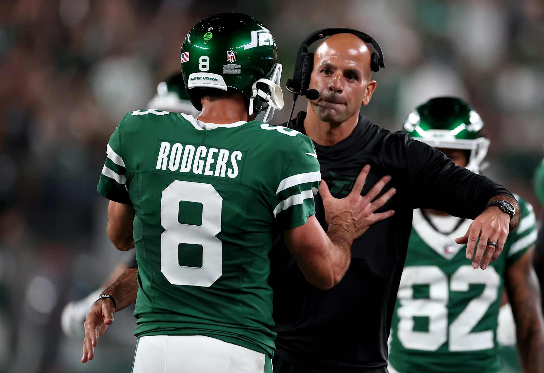 EAST RUTHERFORD, NEW JERSEY - SEPTEMBER 19: Head coach Robert Saleh of the New York Jets celebrates with Aaron Rodgers #8 after a touchdown against the New England Patriots during the second quarter in the game at MetLife Stadium on September 19, 2024 in East Rutherford, New Jersey. (Photo by Al Bello/Getty Images) EAST RUTHERFORD, NEW JERSEY - SEPTEMBER 19: Head coach Robert Saleh of the New York Jets celebrates with Aaron Rodgers #8 after a touchdown against the New England Patriots during the second quarter in the game at MetLife Stadium on September 19, 2024 in East Rutherford, New Jersey. (Photo by Al Bello/Getty Images)