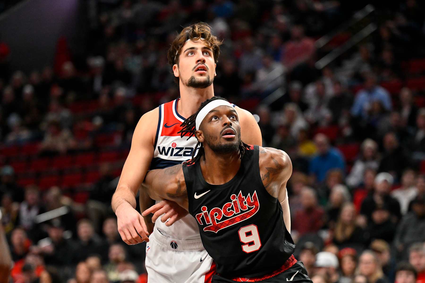 PORTLAND, OREGON - DECEMBER 21: Deni Avdija #8 of the Washington Wizards and Jerami Grant #9 of the Portland Trail Blazers in action during the first quarter of the game at the Moda Center on December 21, 2023 in Portland, Oregon. The Washington Wizards won 118-117. NOTE TO USER: User expressly acknowledges and agrees that, by downloading and or using this photograph, User is consenting to the terms and conditions of the Getty Images License Agreement. (Photo by Alika Jenner/Getty Images)